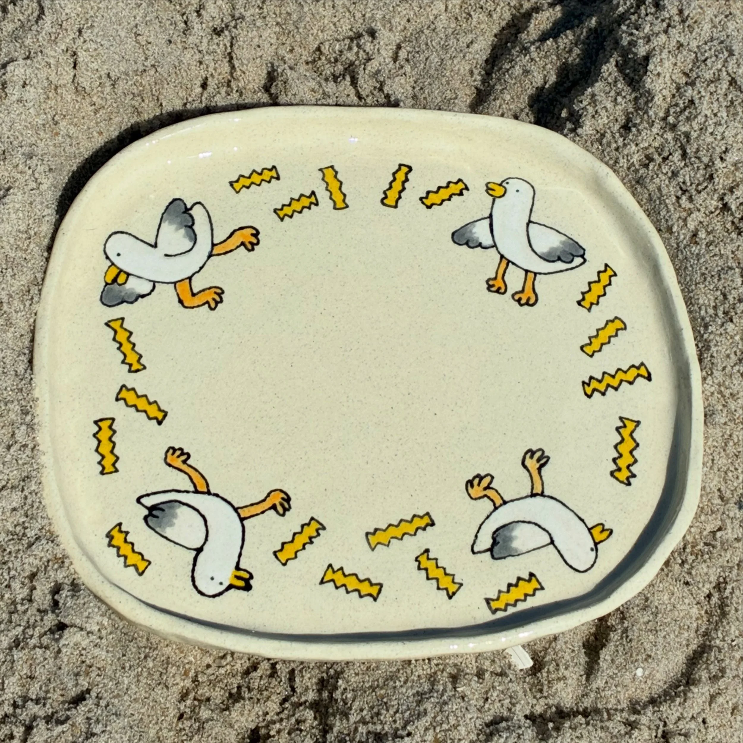 this plate set is inspired by the love a seagull has for a french fry. seagulls and i are alike in that way. anyway these are for sale! edit:SOLD 🍟🌊