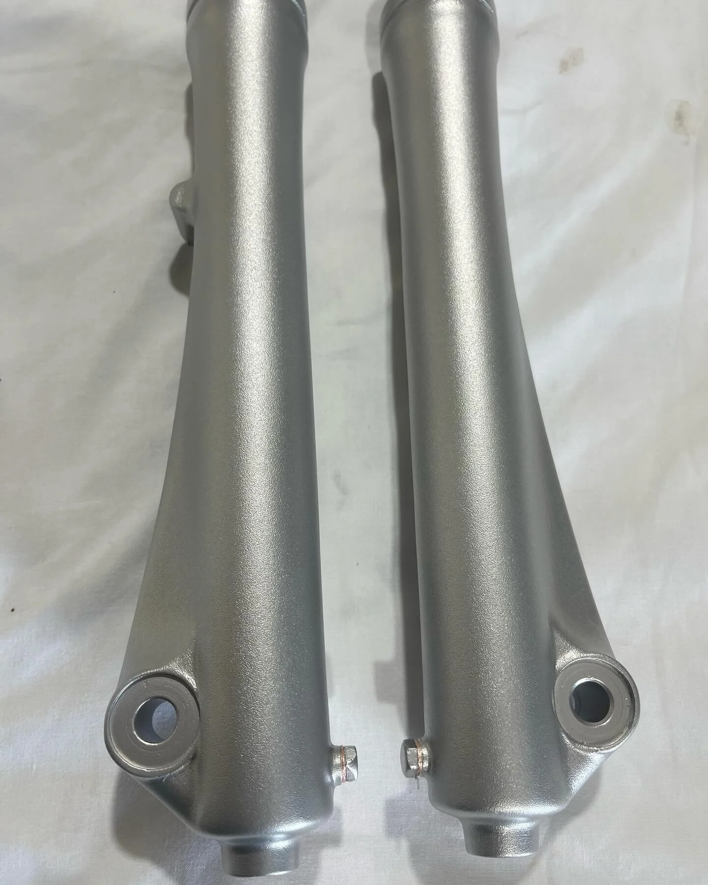 These Honda forks look much more presentable after removing corrosion and deep scratches.  I then put an even textured finish back into the surface and finished off with some vapour blasting to give them a nice, easy to clean fresh new look.