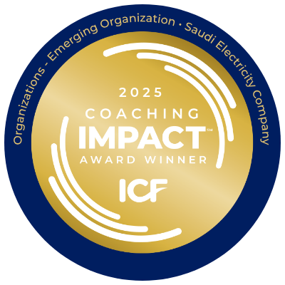 Gold and navy circular badge stating '2025 Coaching Impact Award Winner ICF' with the words 'Organizations - Emerging Organization - Saudi Electricity Company' around the outer edge.