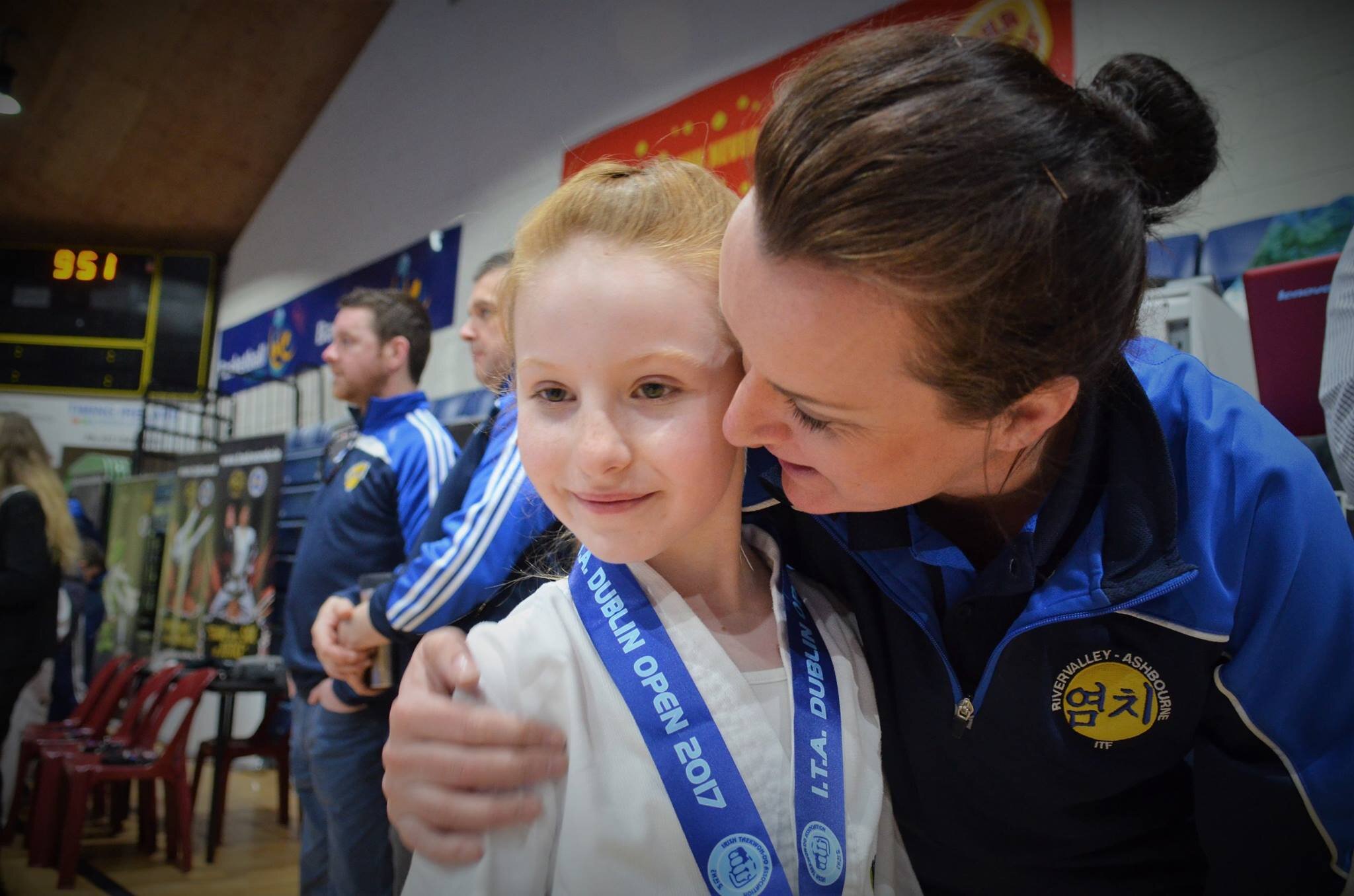 Girl celebrating her medal in Taekwan-do.jpg