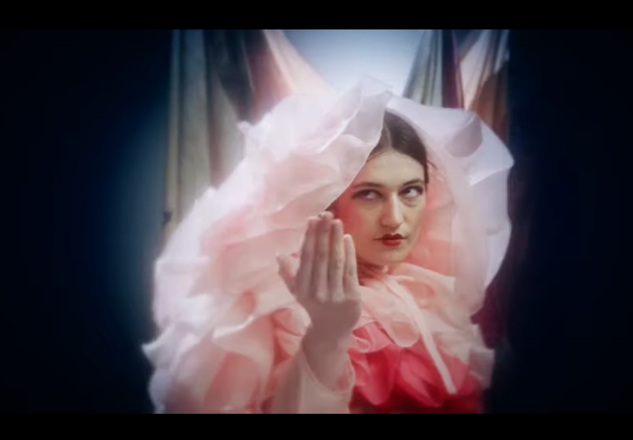 Installation view showing dynamic colour and drape Temporal change in fabric arrangement captured on camera Collaborative music and textile performance installation