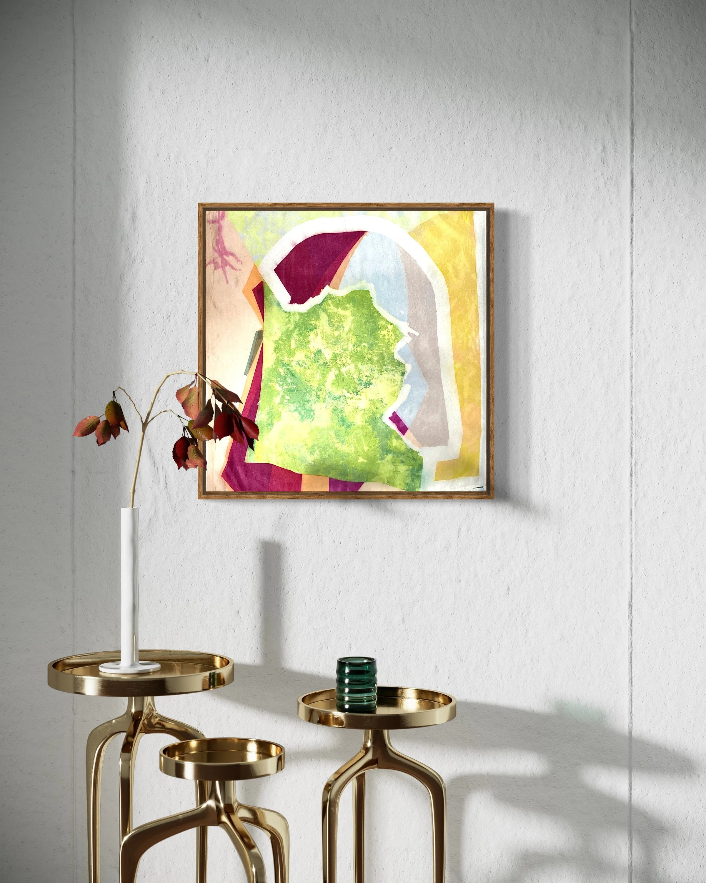 Decorative interior with a white textured wall, a colorful abstract painting, and gold-toned side tables with vases.