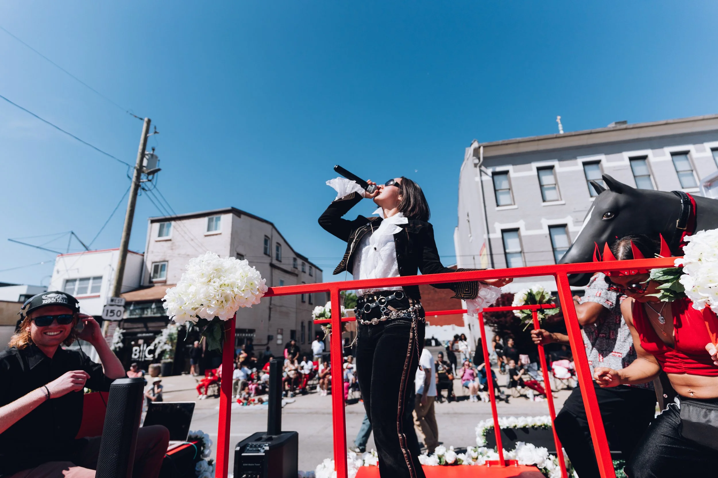   ÅNGEL 004 performing at the Kentucky Derby Pegasus Parade in April 2026.  