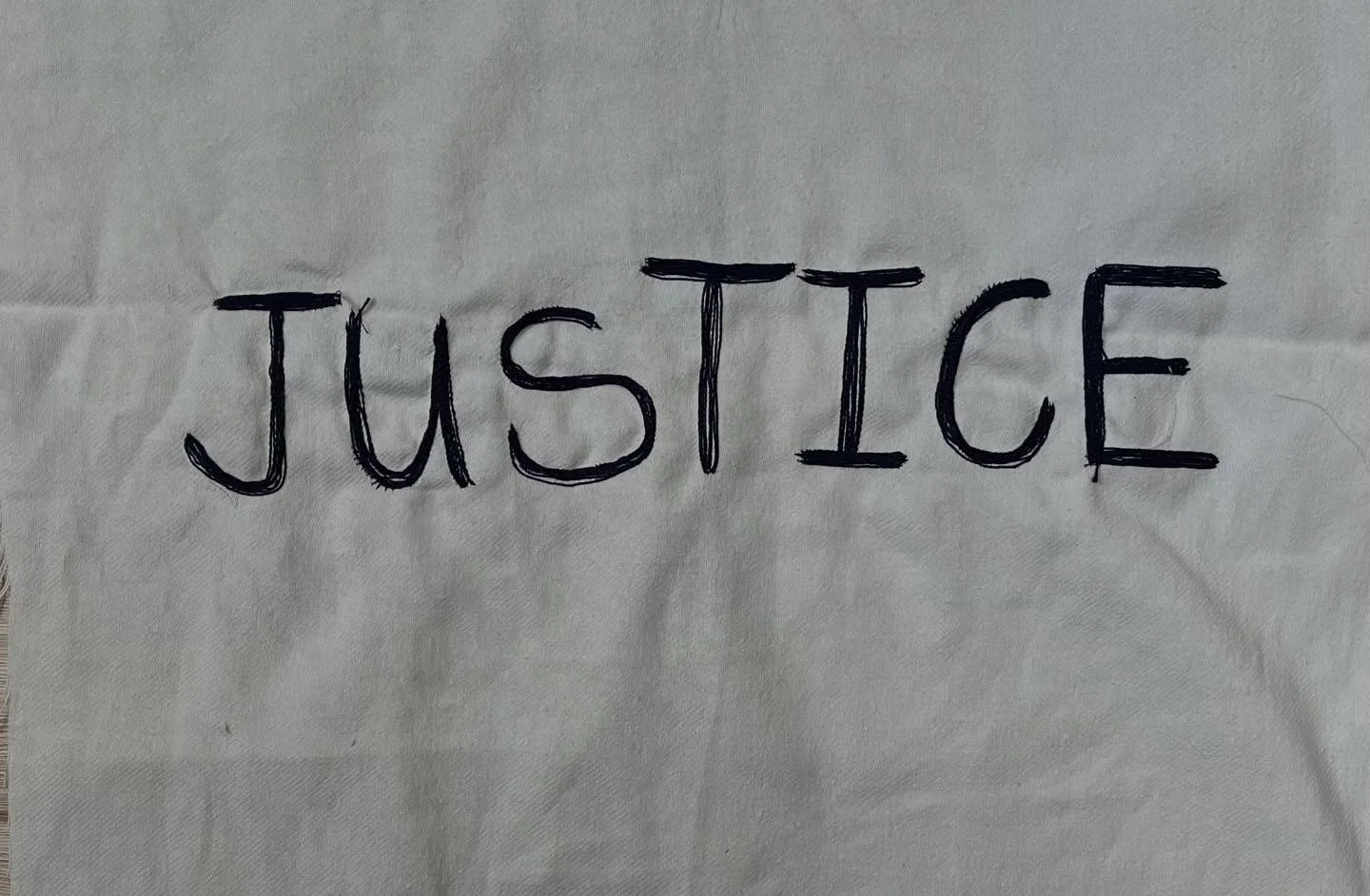 Trying out more ways of stitching words on a banner. JUSTICE is the key word at the centre of my manifesto and so appropriate for this trial. 
Stitching from the back allows a thicker thread to be used. It also means you have to get used to mirror wr
