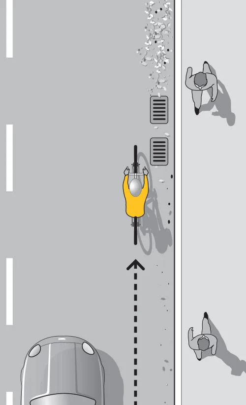 The law requires traffic moving less than the normal speed of traffic to keep as close as practicable to the right hand curb or edge of the roadway, but that does not mean hugging the curb or edge of the road.