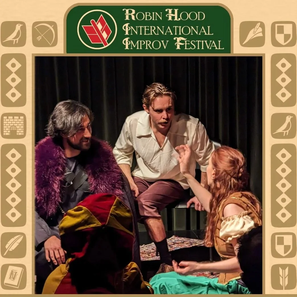 This is a picture os some improvisers sitting and playing a scene on stage at the Robin Hood International Improv Festival in Nottingham