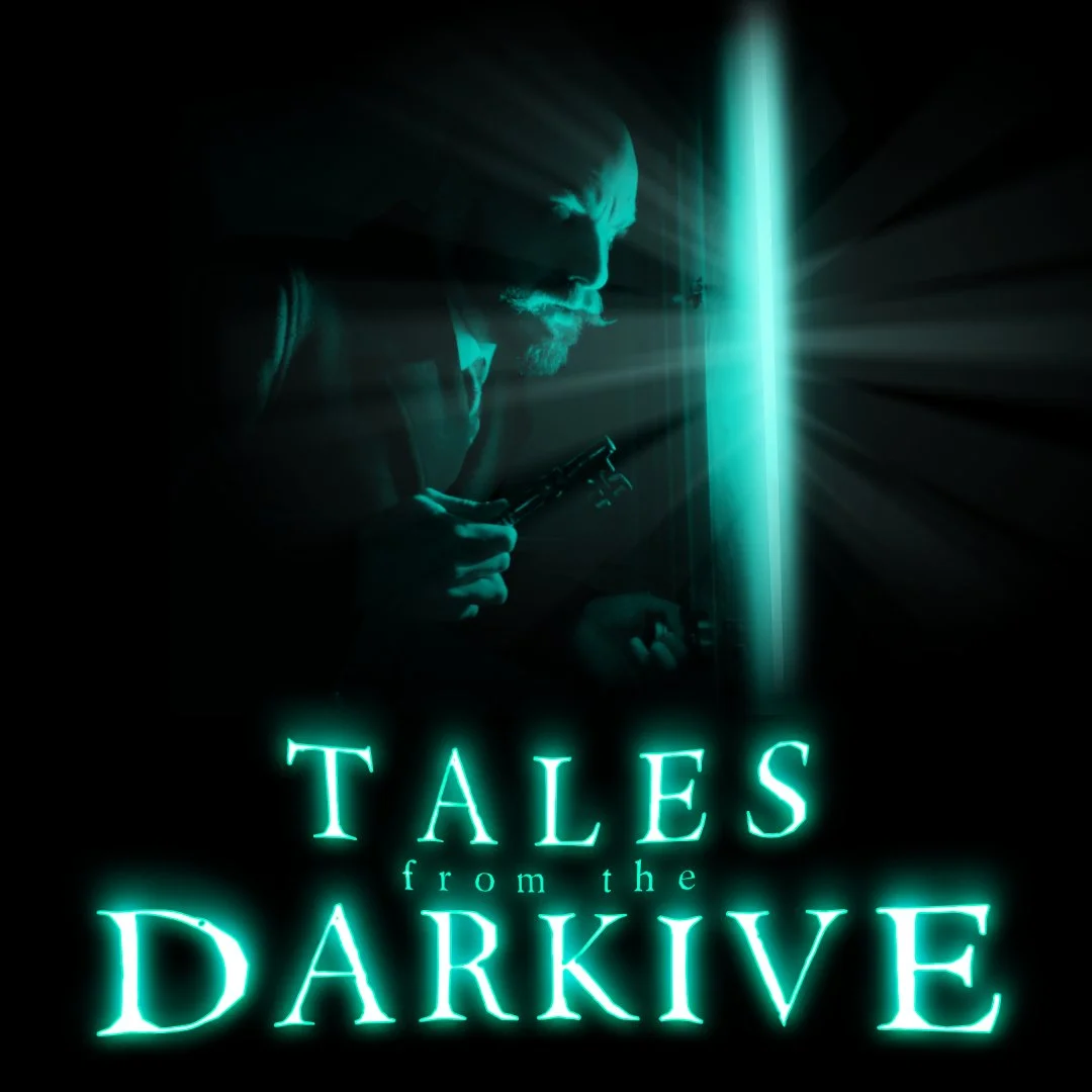 A man looks at a green light with the words Tales from the Darkive underneath