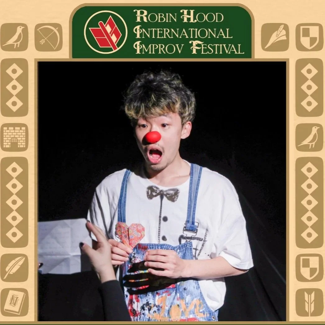A performer wearing a clown nose looks shocked