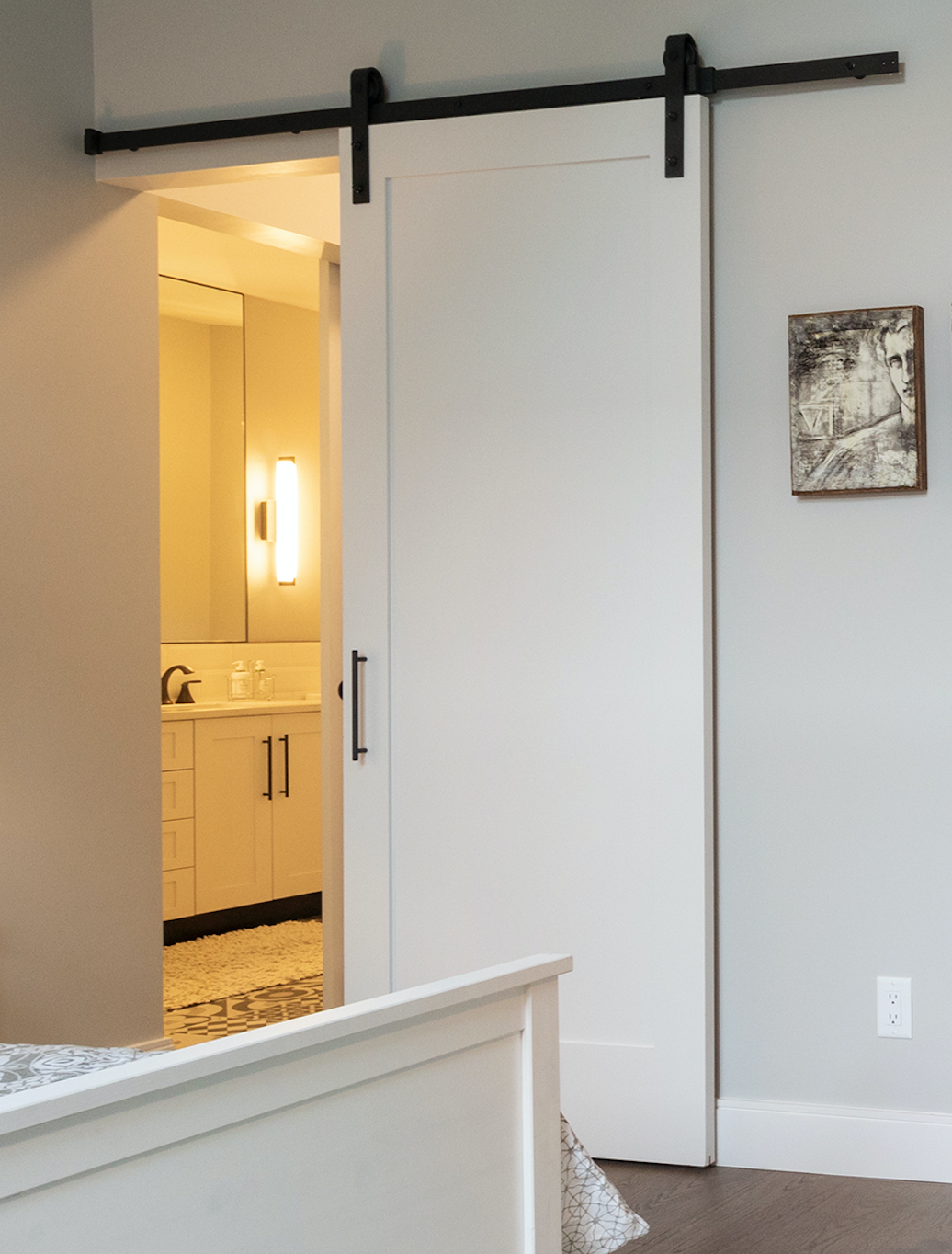 Barn Door with black hardware in Seafield Homes.png