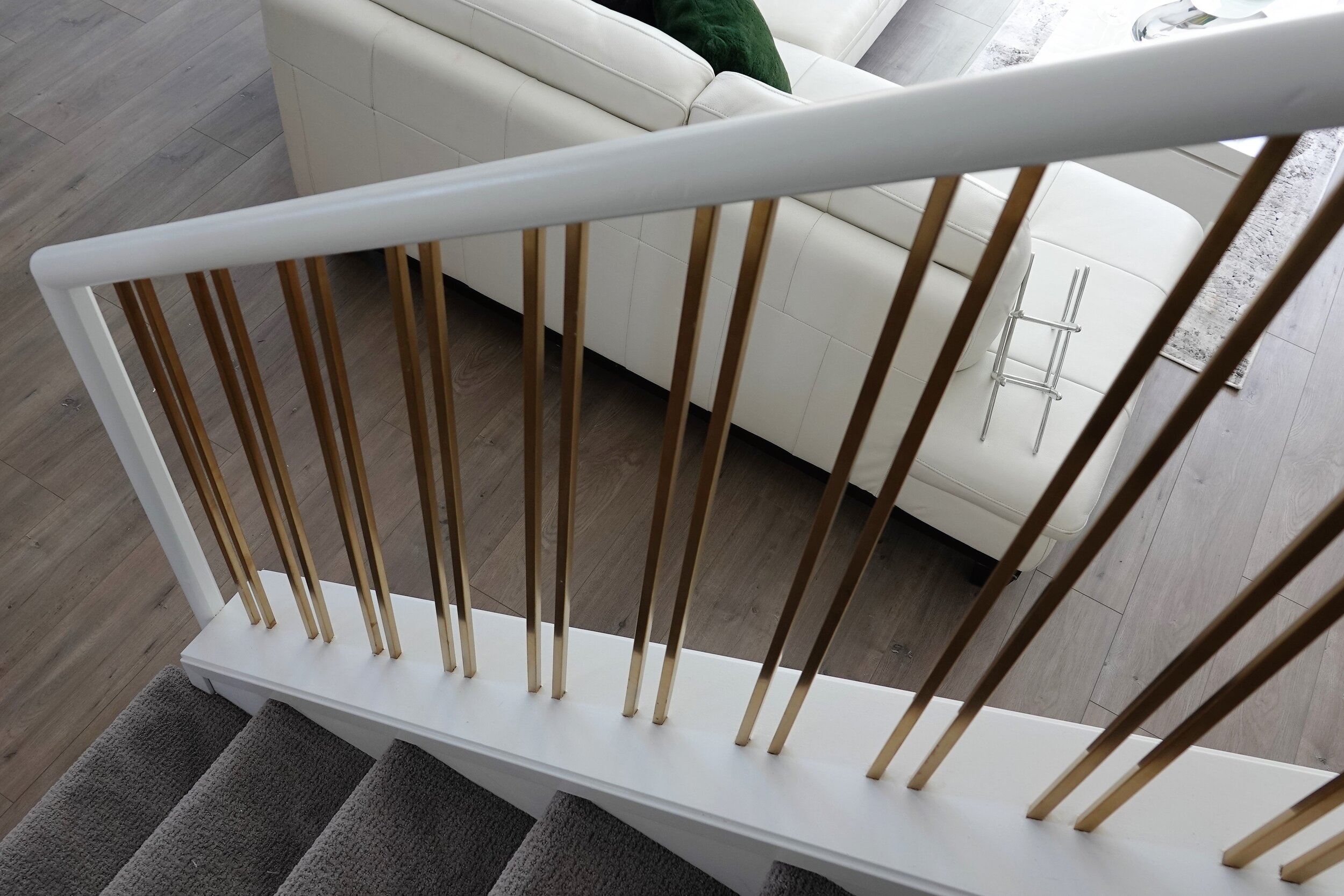 Seafield - White Wooden Staircase with gold pickets.JPG