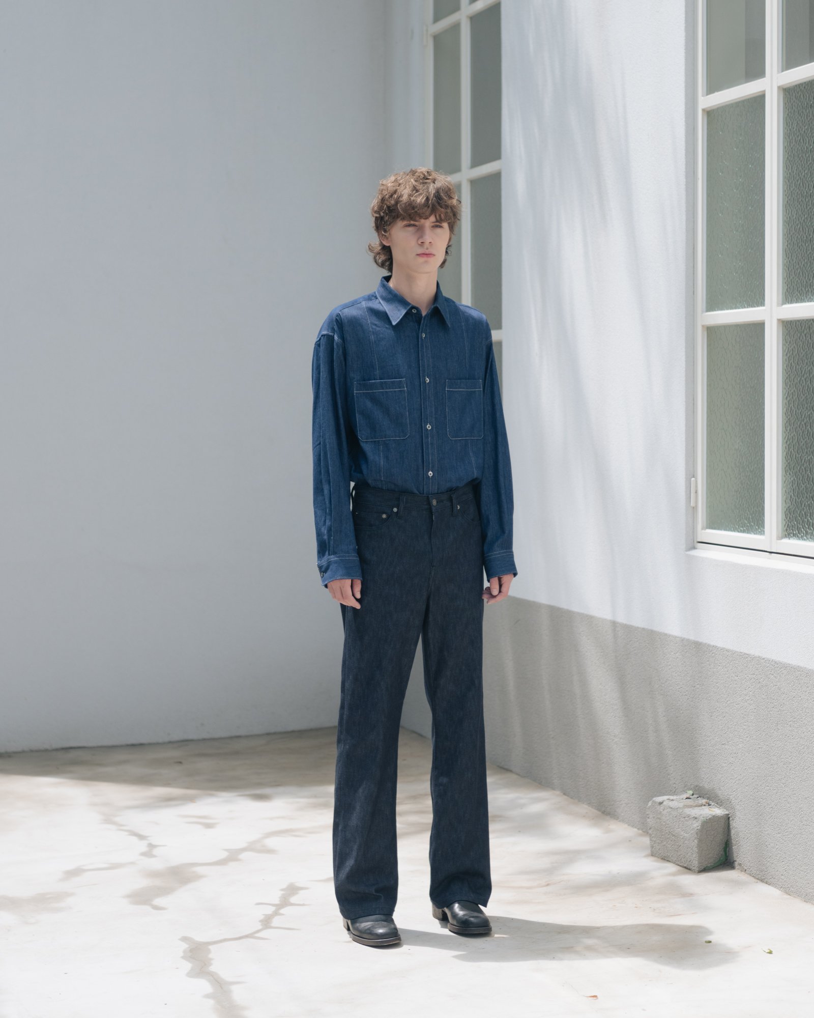 Full body photograph of a male model in Seoul