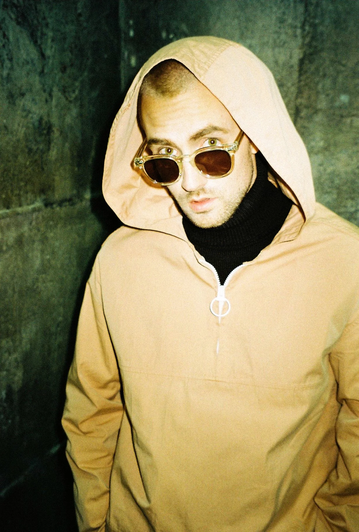 35mm flash photograph of a male model wearing sunglasses