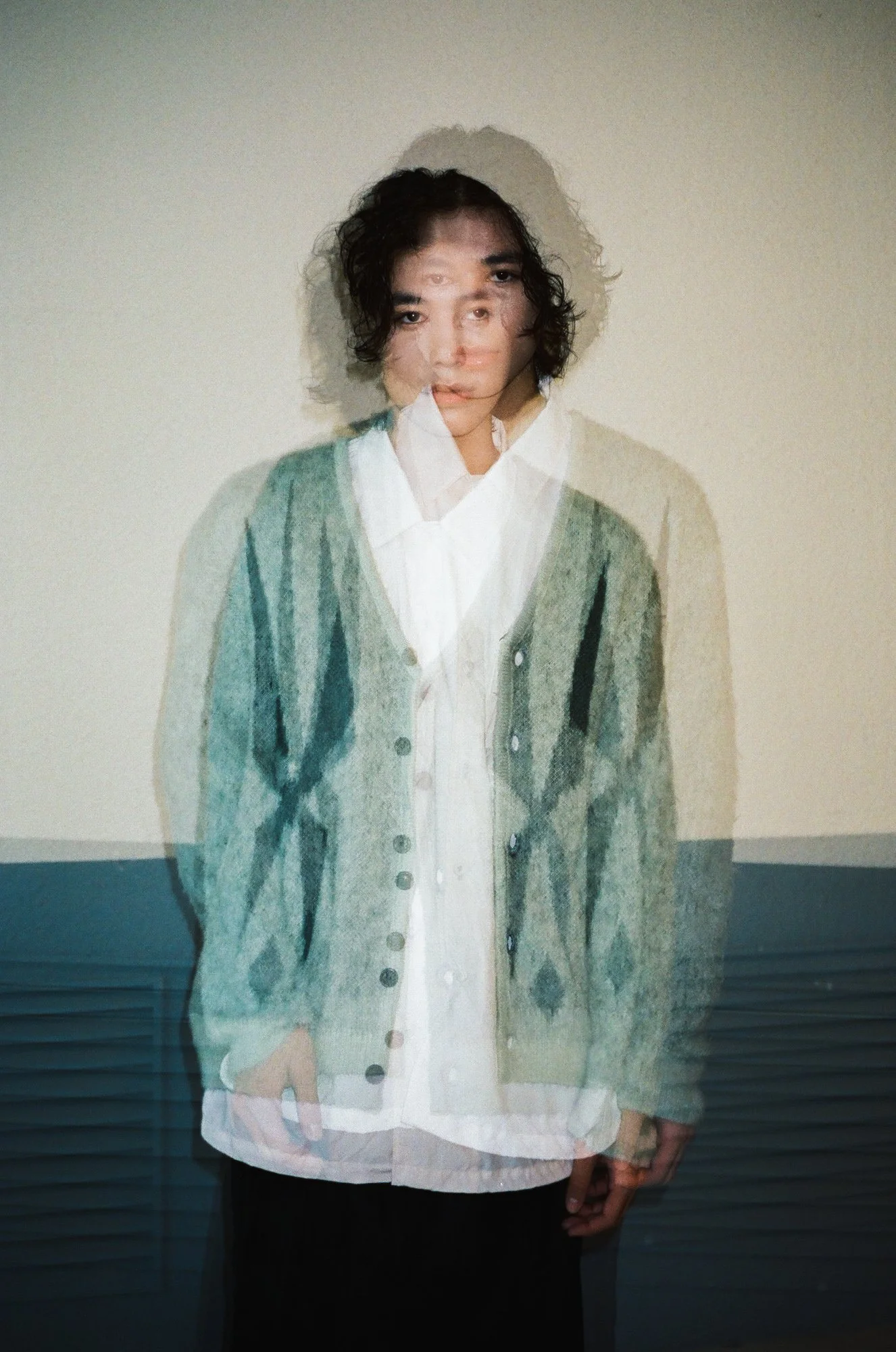 35mm double exposure photograph of a male model wearing a cardigan