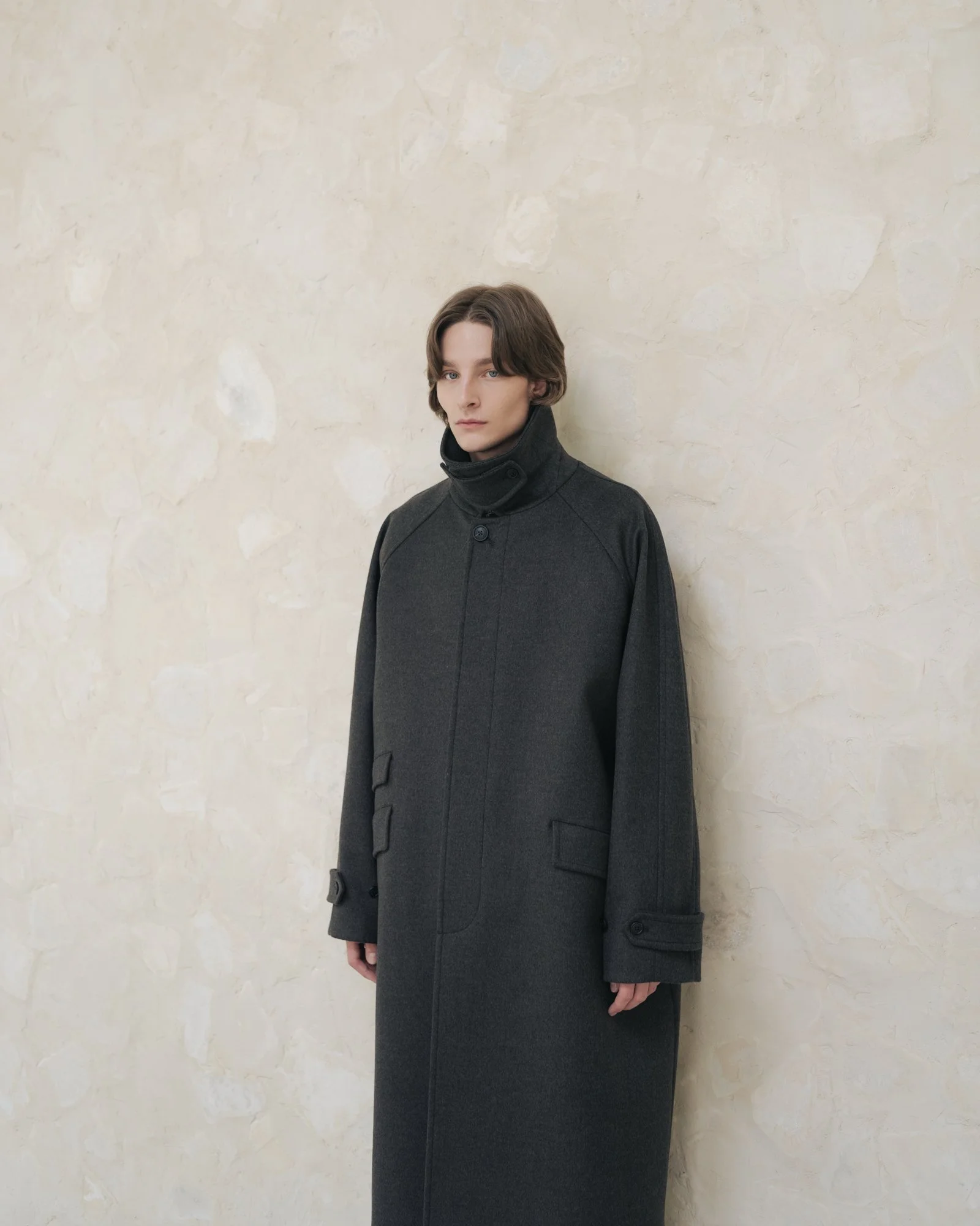 Clean photograph of a male model wearing a coat in Seoul