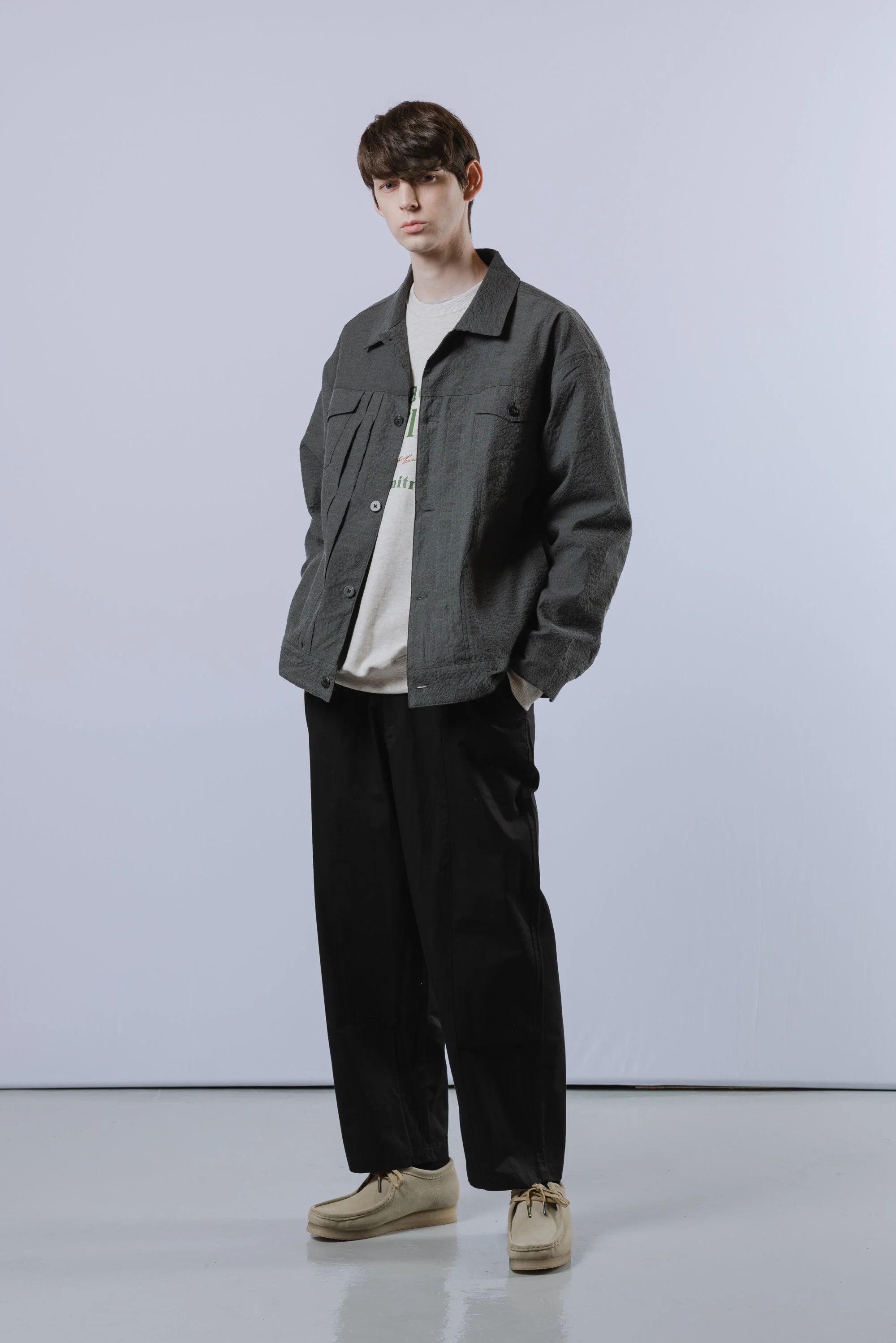 Cool-toned fashion photograph of a male model in studio in Seoul