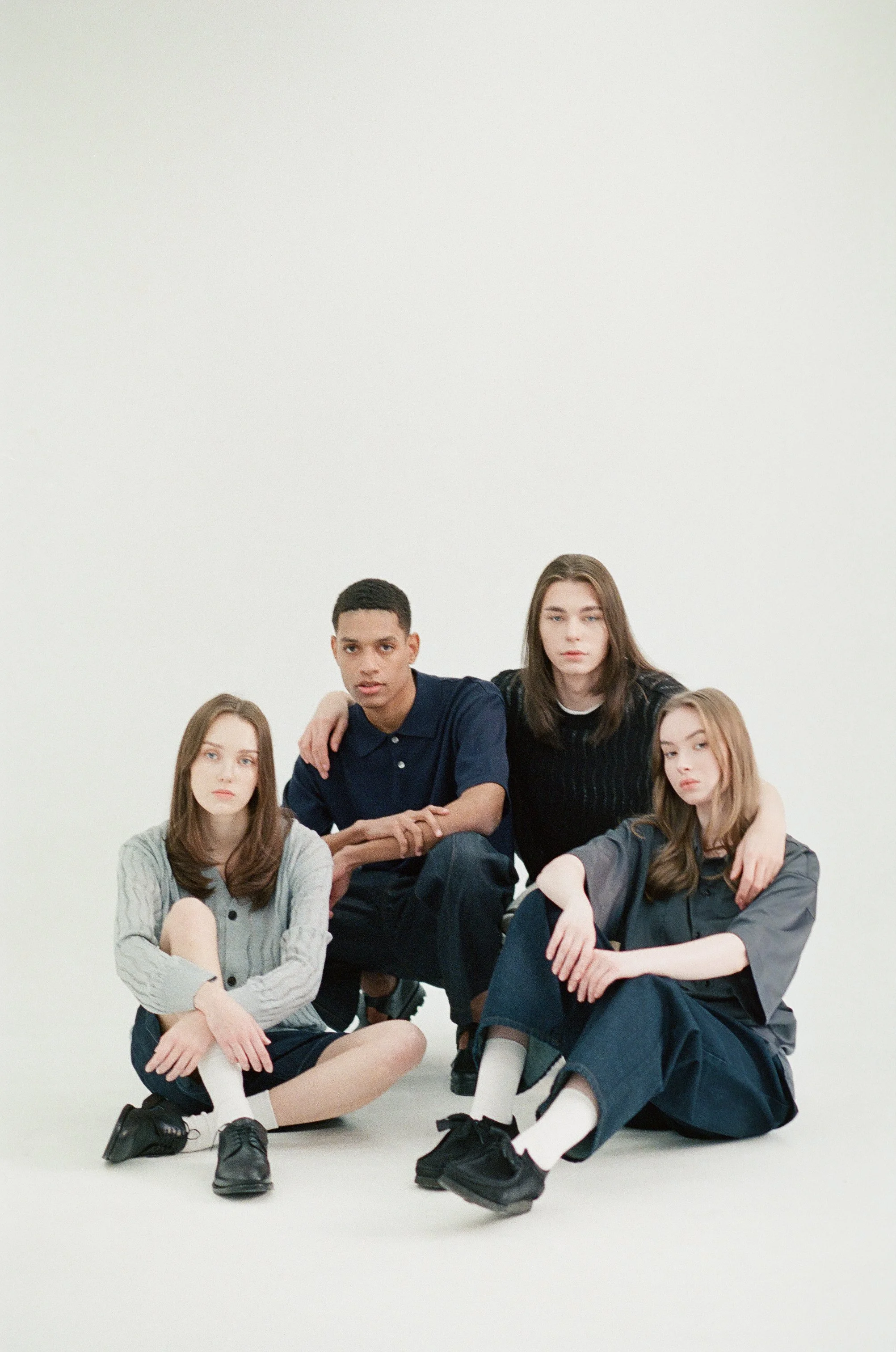 35mm fashion photograph of four models in a studio