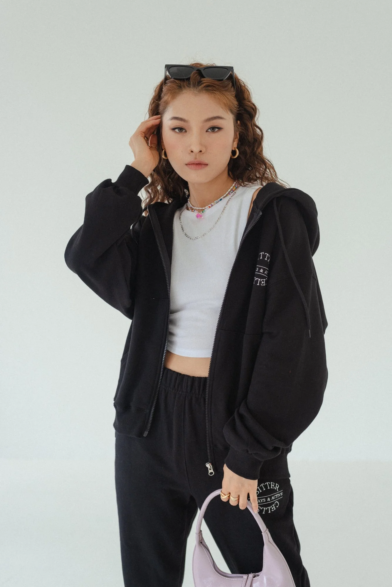 Fashion photograph of a Korean female model in a white studio