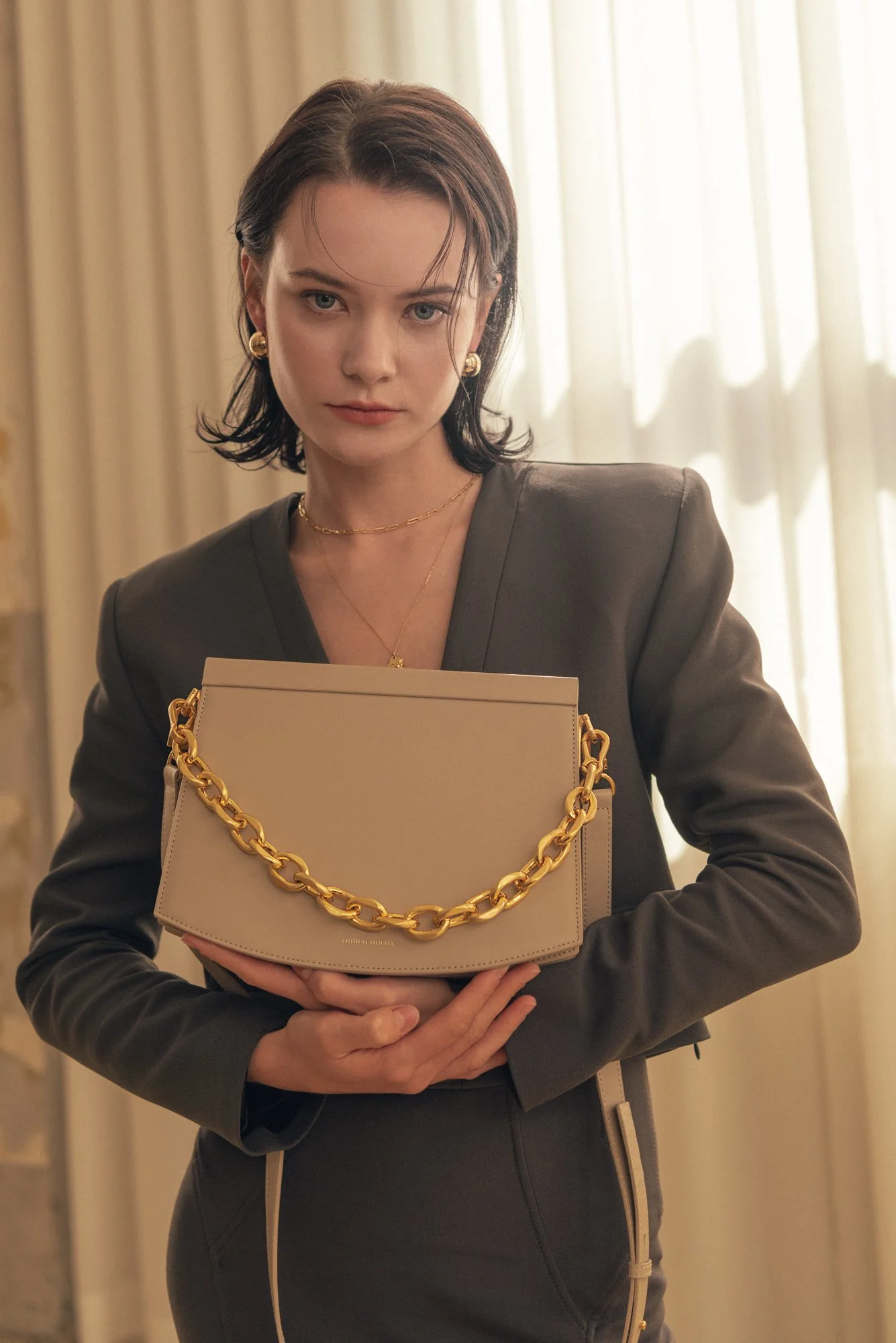 Fashion photograph of a female model holding a handbag in Seoul