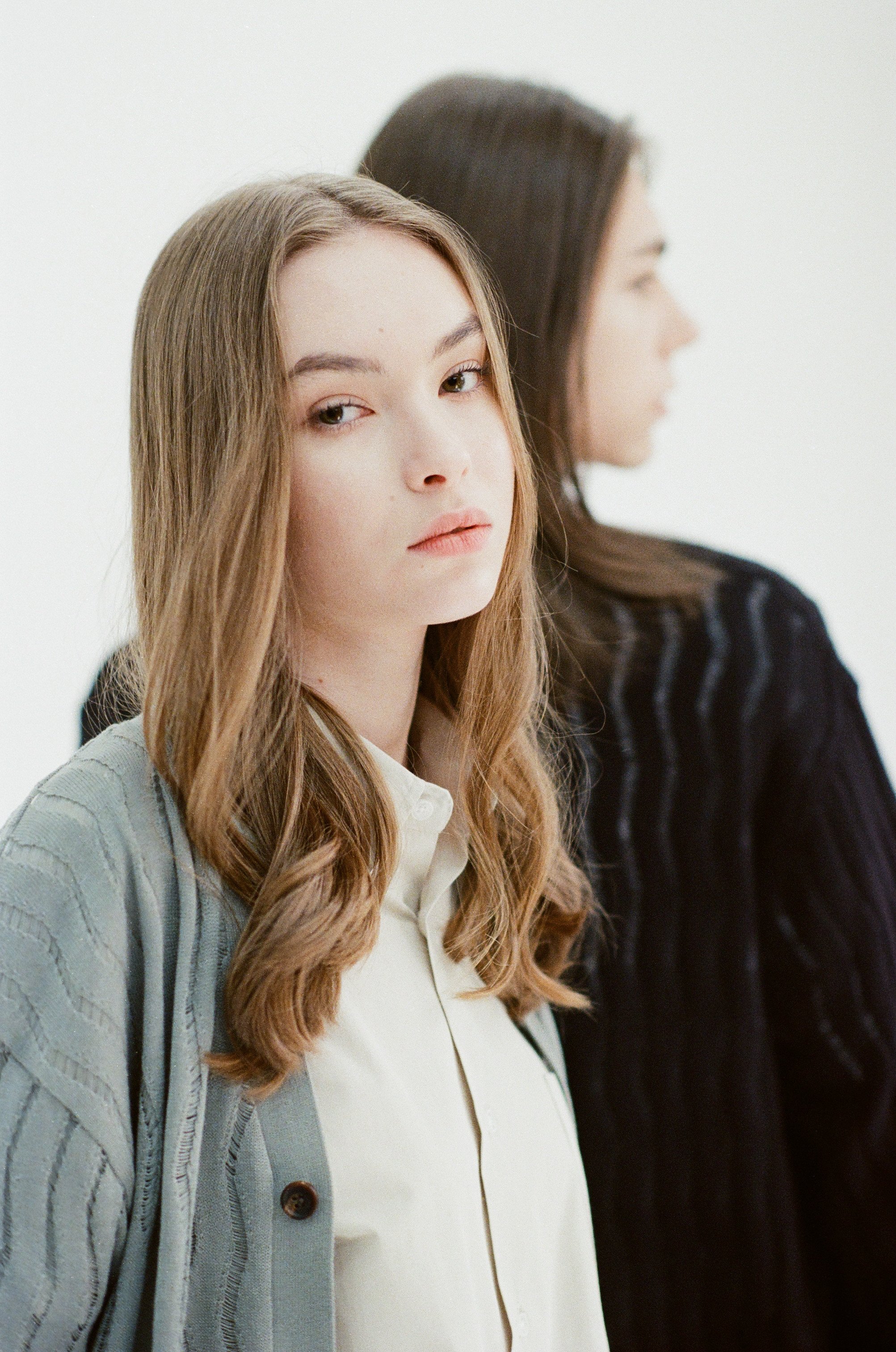 35mm fashion photograph of two models with long hair