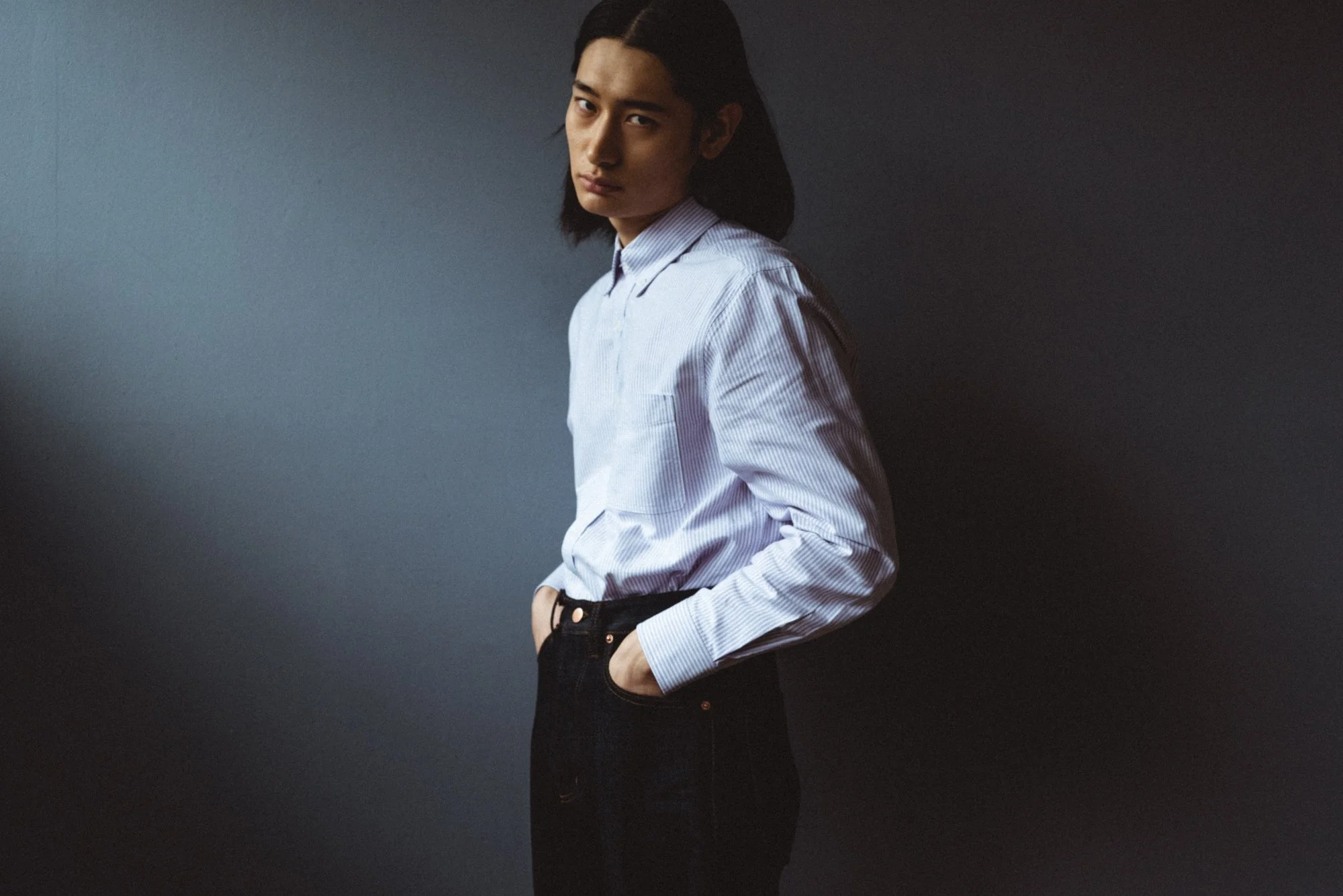 Photograph of a Korean model in low key lighting in Seoul