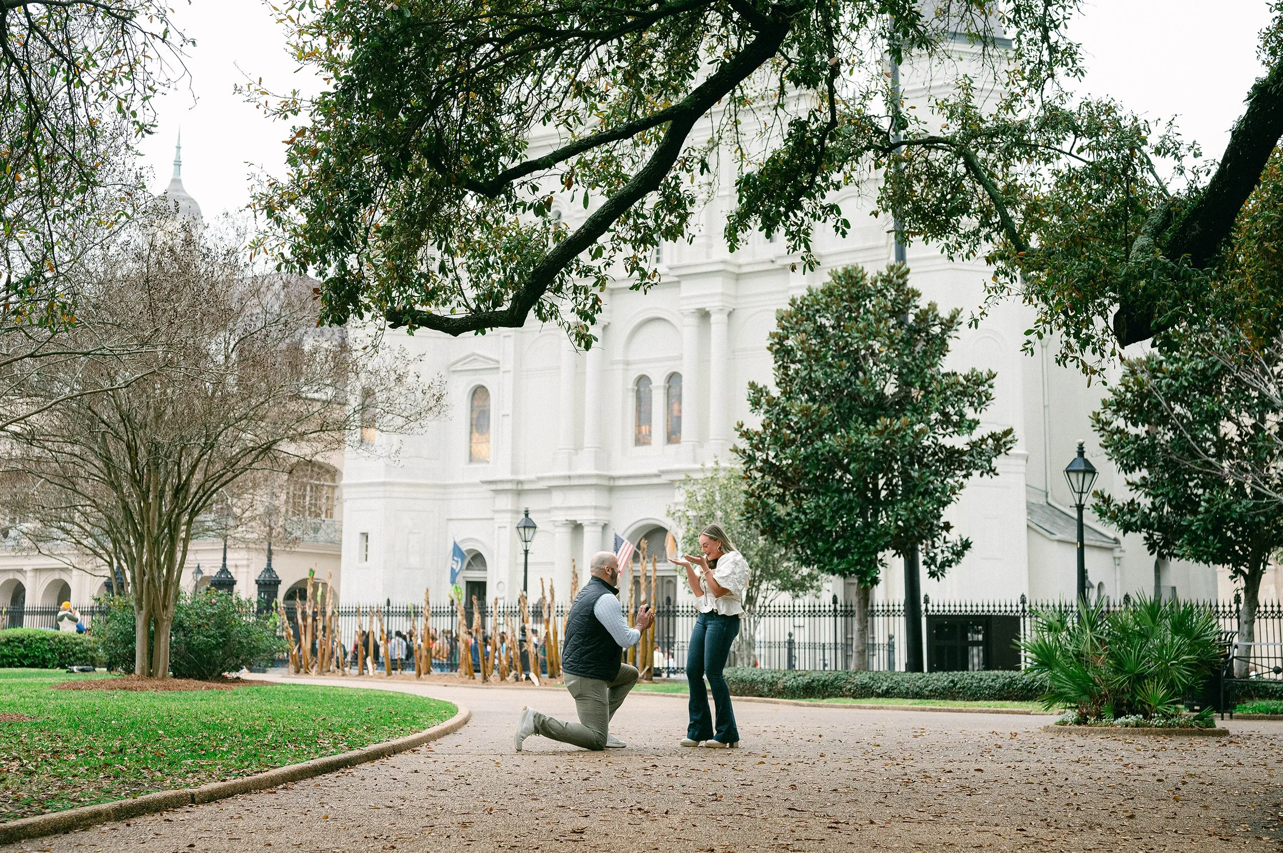 A man proposing marriage to a woman in New Orleans French Quarter