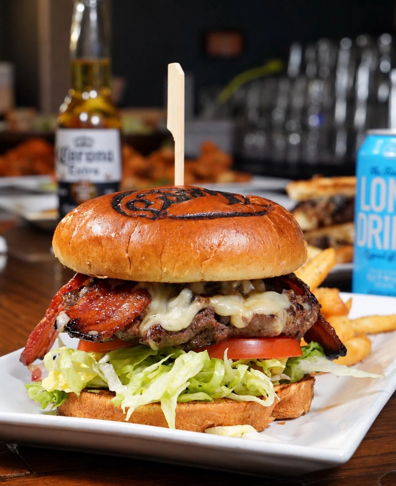 Your Detroit plans deserve a burger this good.

The Smokestack Burger brings smoky flavor to every bite with crispy bacon, smoked gouda and smoky burger sauce piled onto Harry&rsquo;s house-ground burger, finished with lettuce and tomato on a grilled