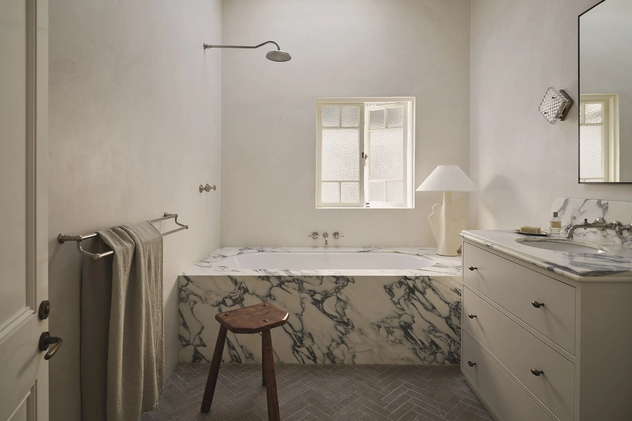 Neutral bathroom palette in restored Queenslander home