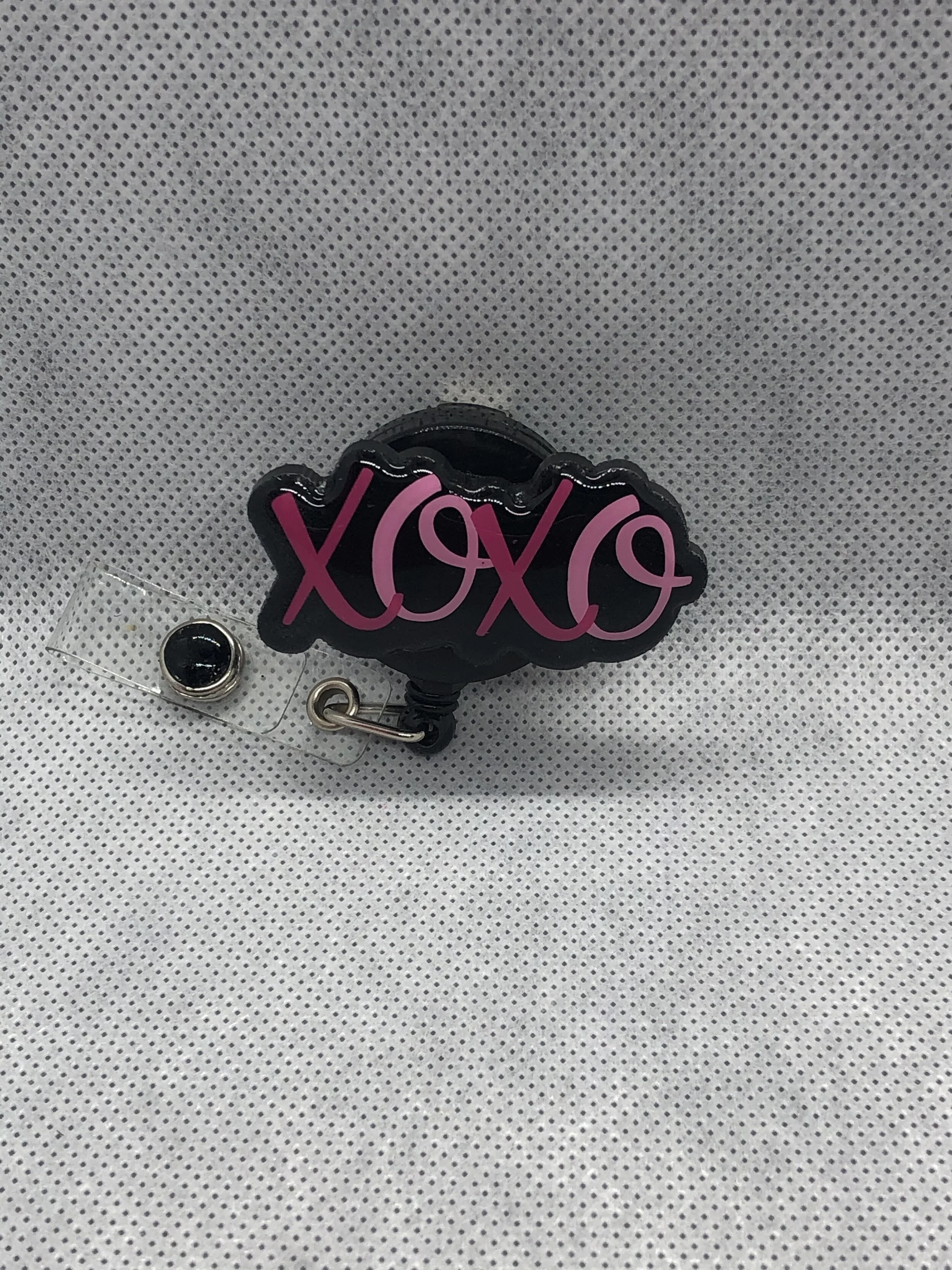 XOXO Badge Reel