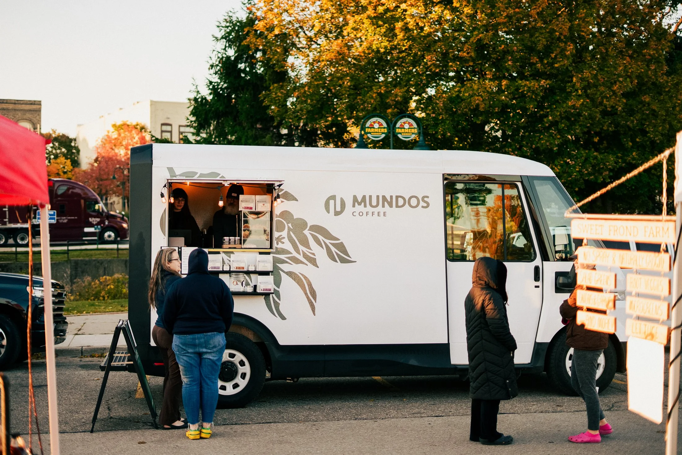 Serving coffee out of the Mundos Coffee Van at the Sara Hardy's Farmer's Market