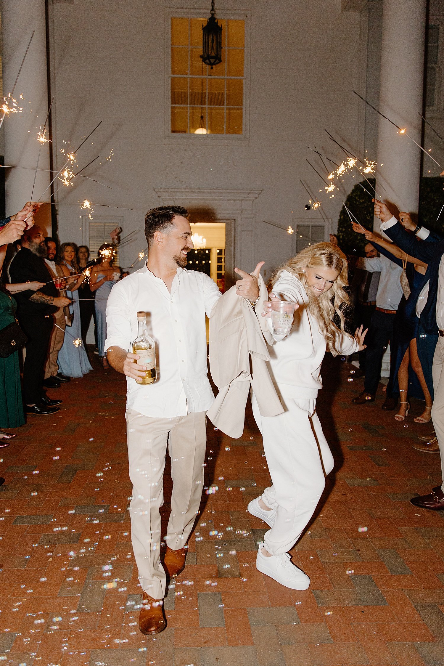  newlyweds exit reception with sparklers at Adams estate  