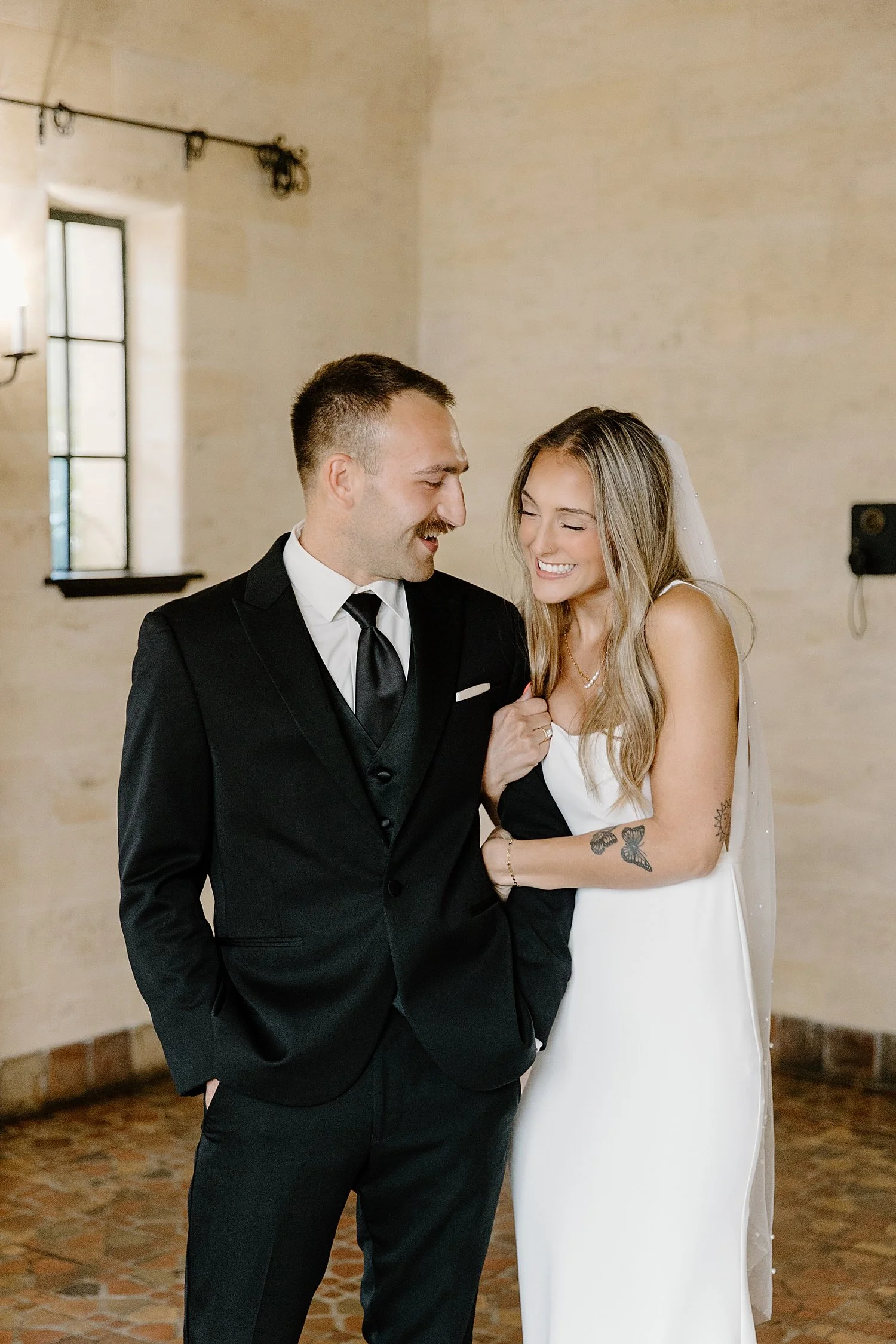 man looks at his bride lovingly during first look by Florida wedding photographer