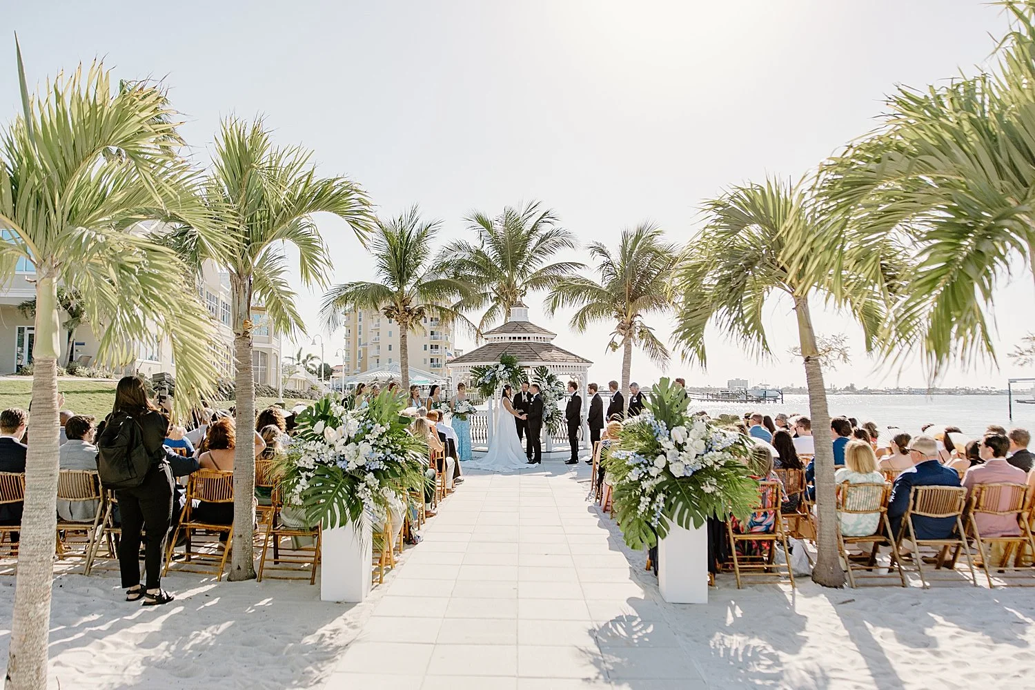engaged couple tie the knot at outdoor ceremony near beach by Taylor Shea Photo