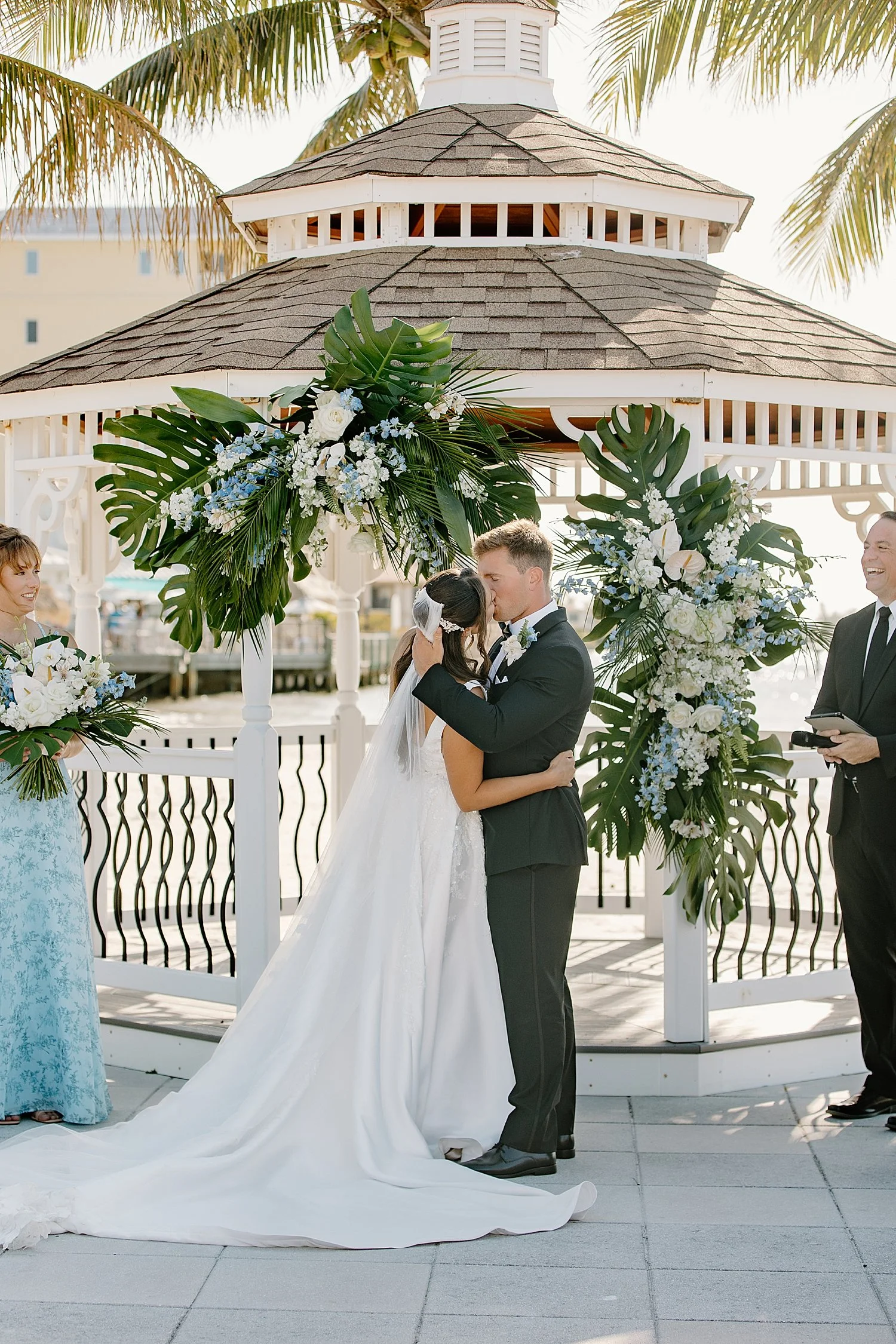 newlyweds share a first kiss during outdoor ceremony at Isla Del Sol Yacht and Country Club