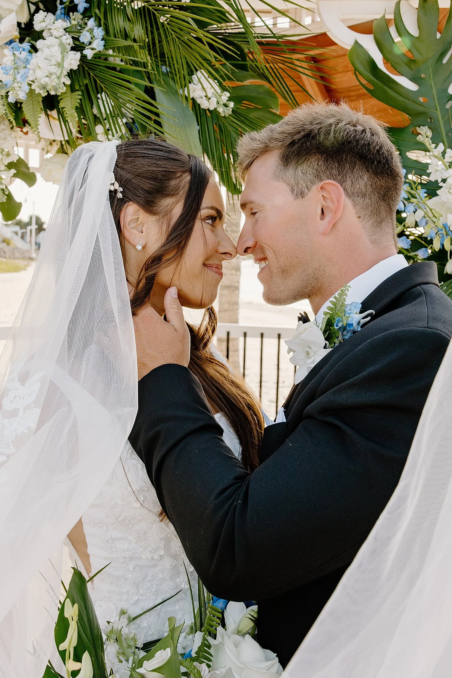 groom lovingly looks at new wife at Isla Del Sol Yacht and Country Club