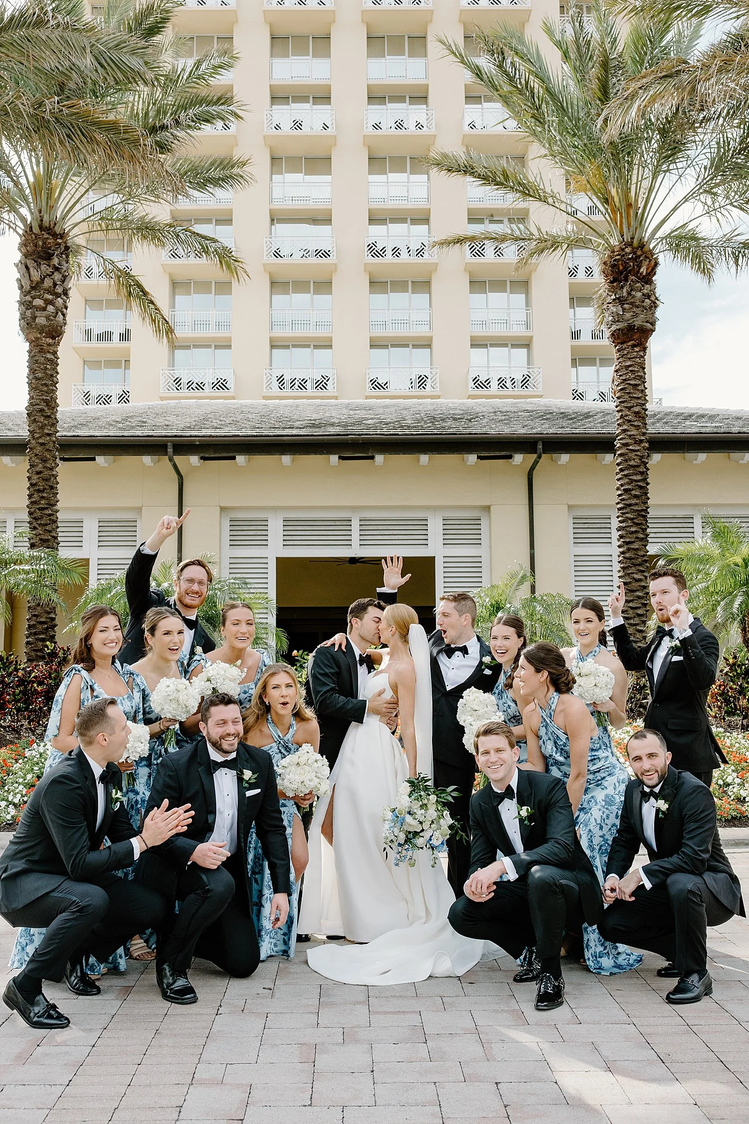  bride and groom surrounded by their bridal party by Florida wedding photographer 