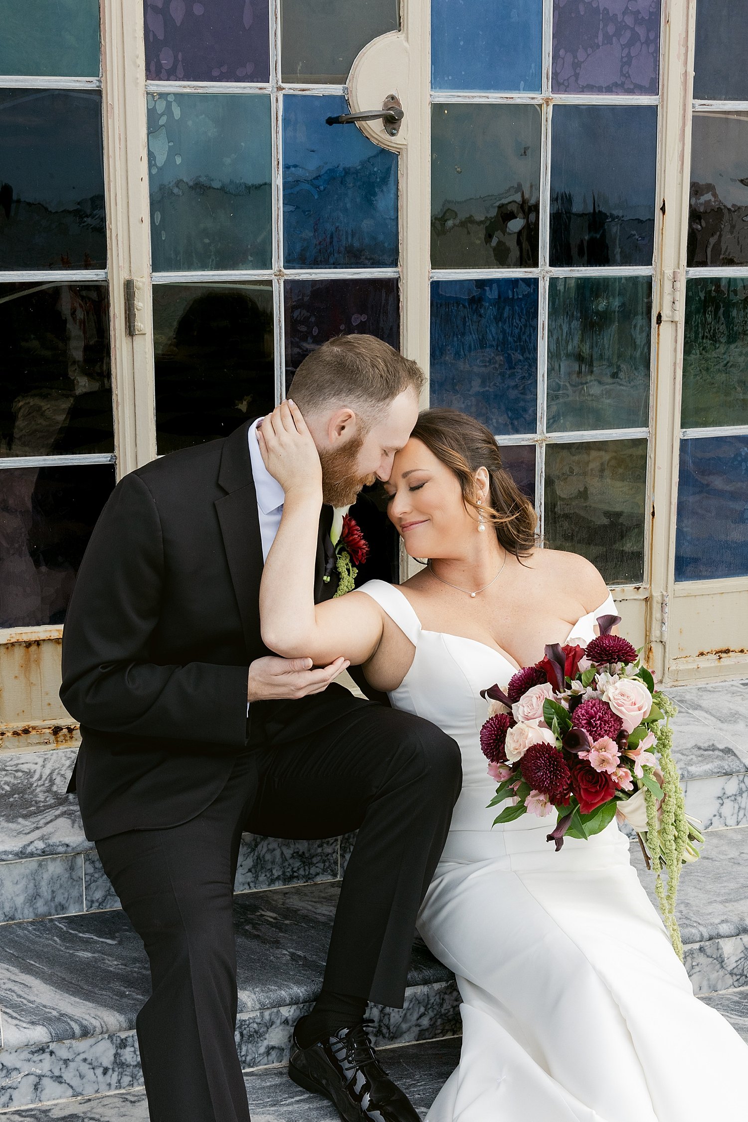 woman and man sit on steps at ringling museum by Taylor Shea Photo 