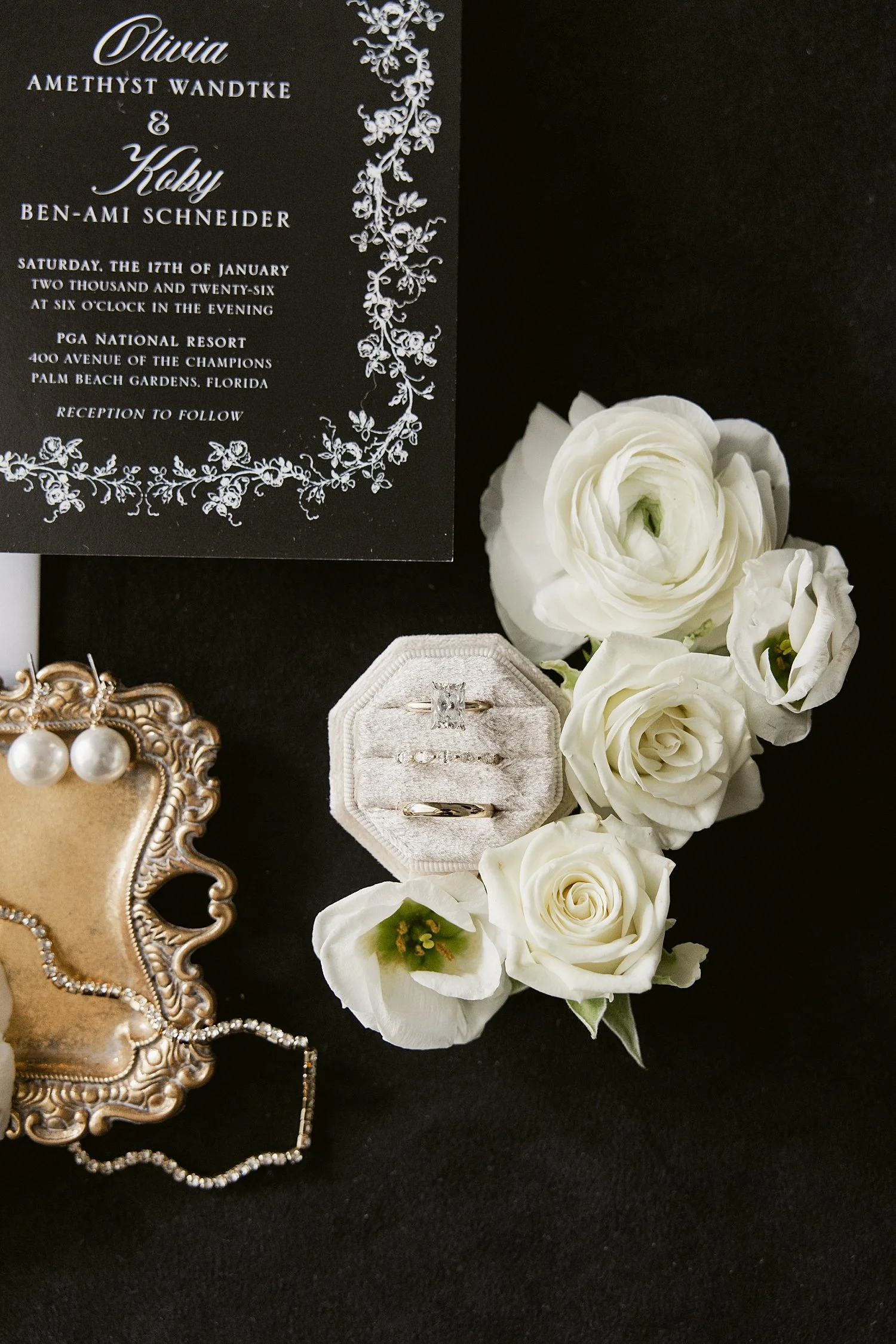  rings sit in velvet boxes next to flowers by Taylor Shea Photo 