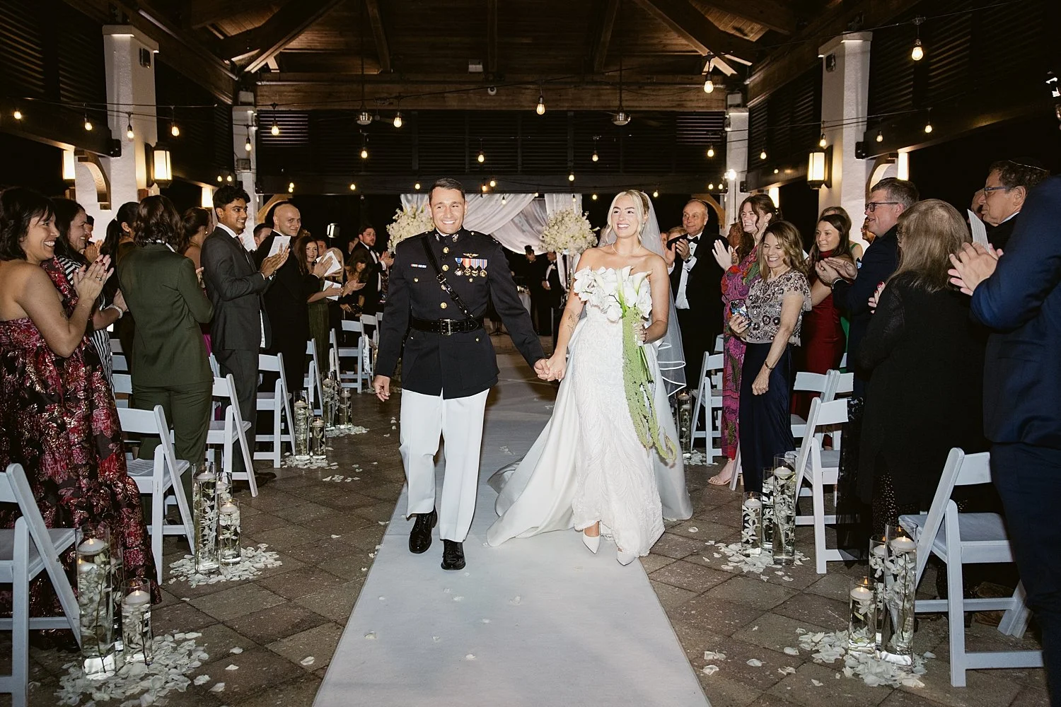  newlyweds walk back down the aisle after saying I Do by Florida wedding photographer 