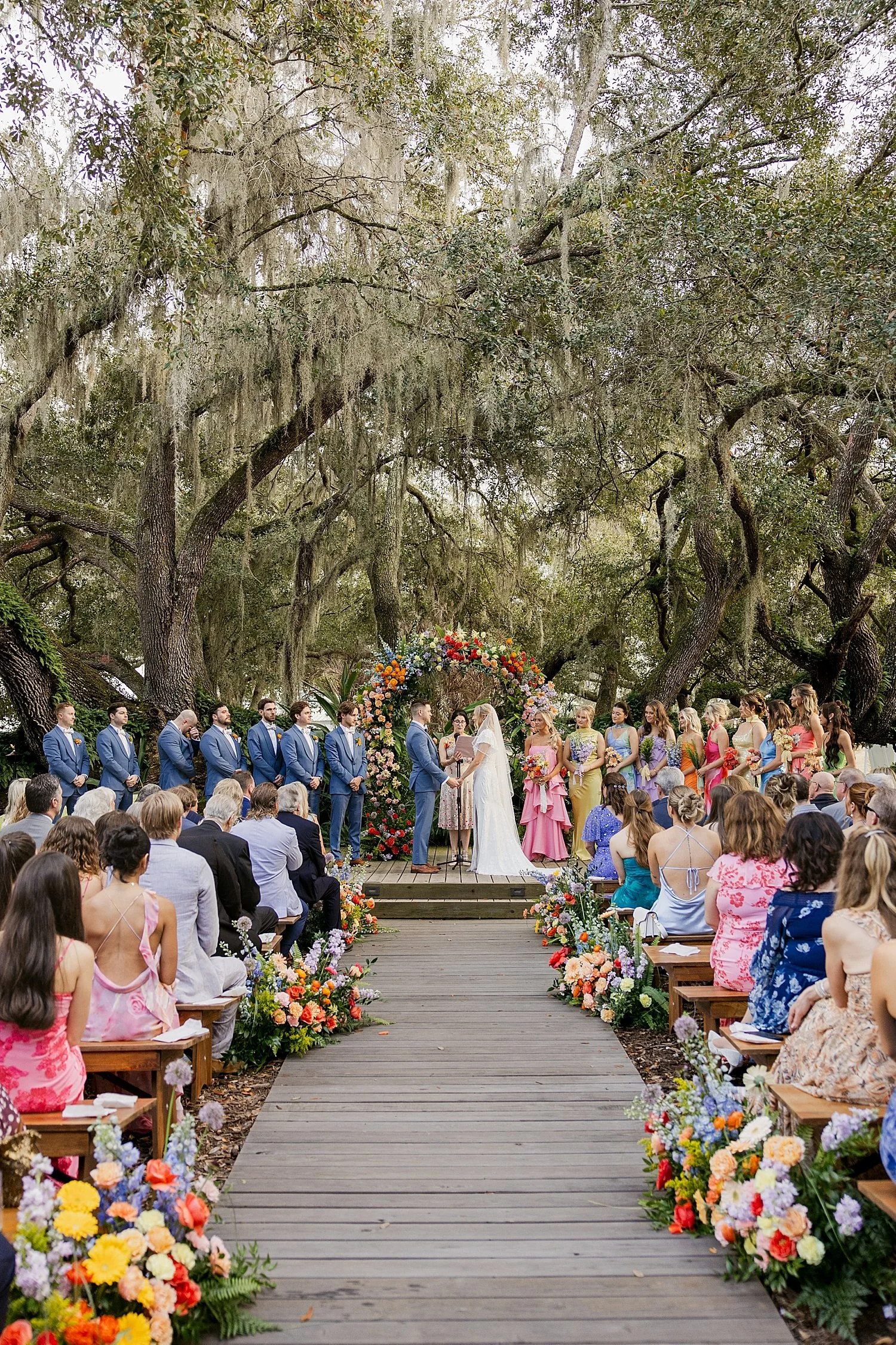  couple stands at outdoor alter with guests watching by Taylor Shea Photo 