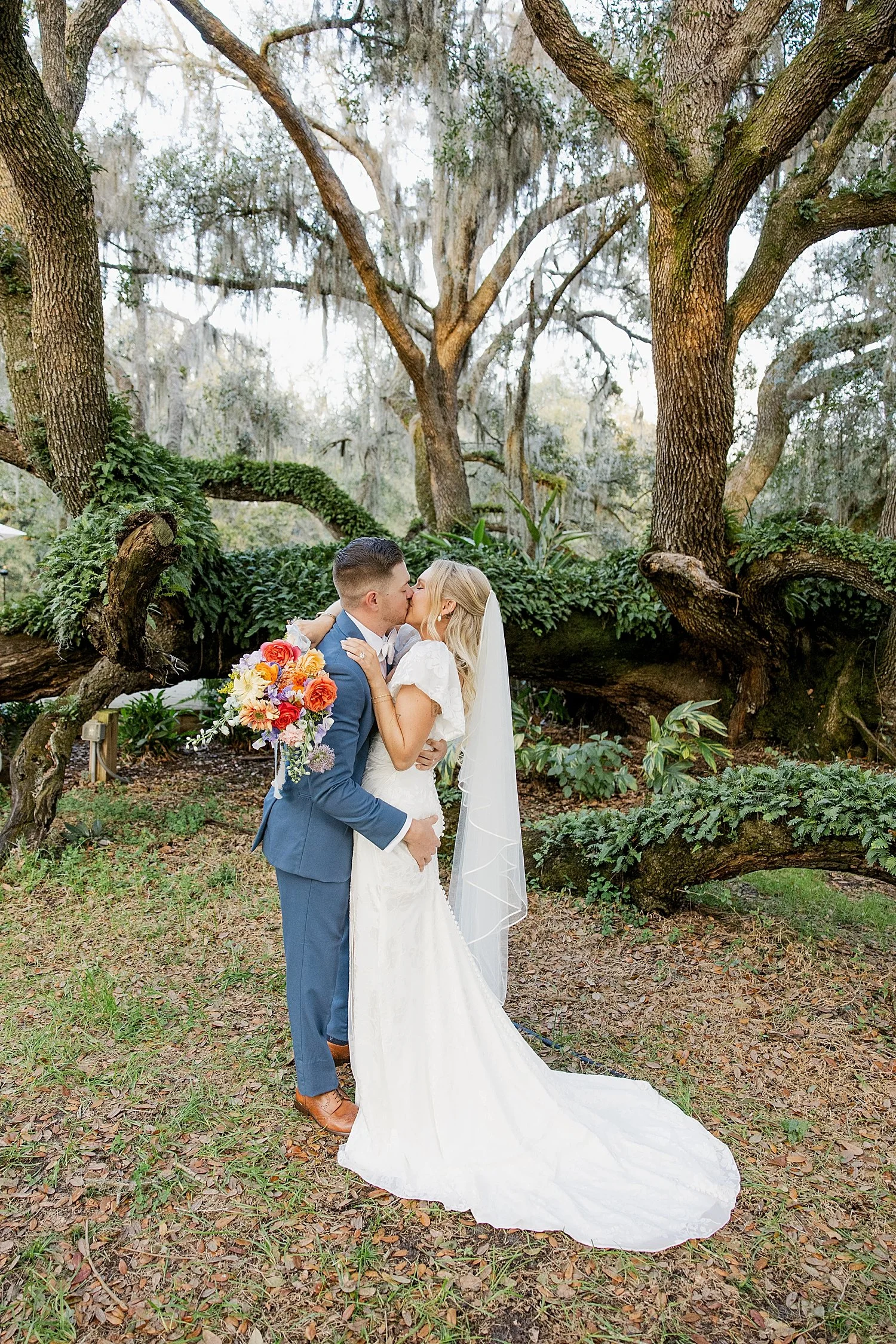  newlyweds hug tightly on lawn after saying I Do by Taylor Shea Photo 