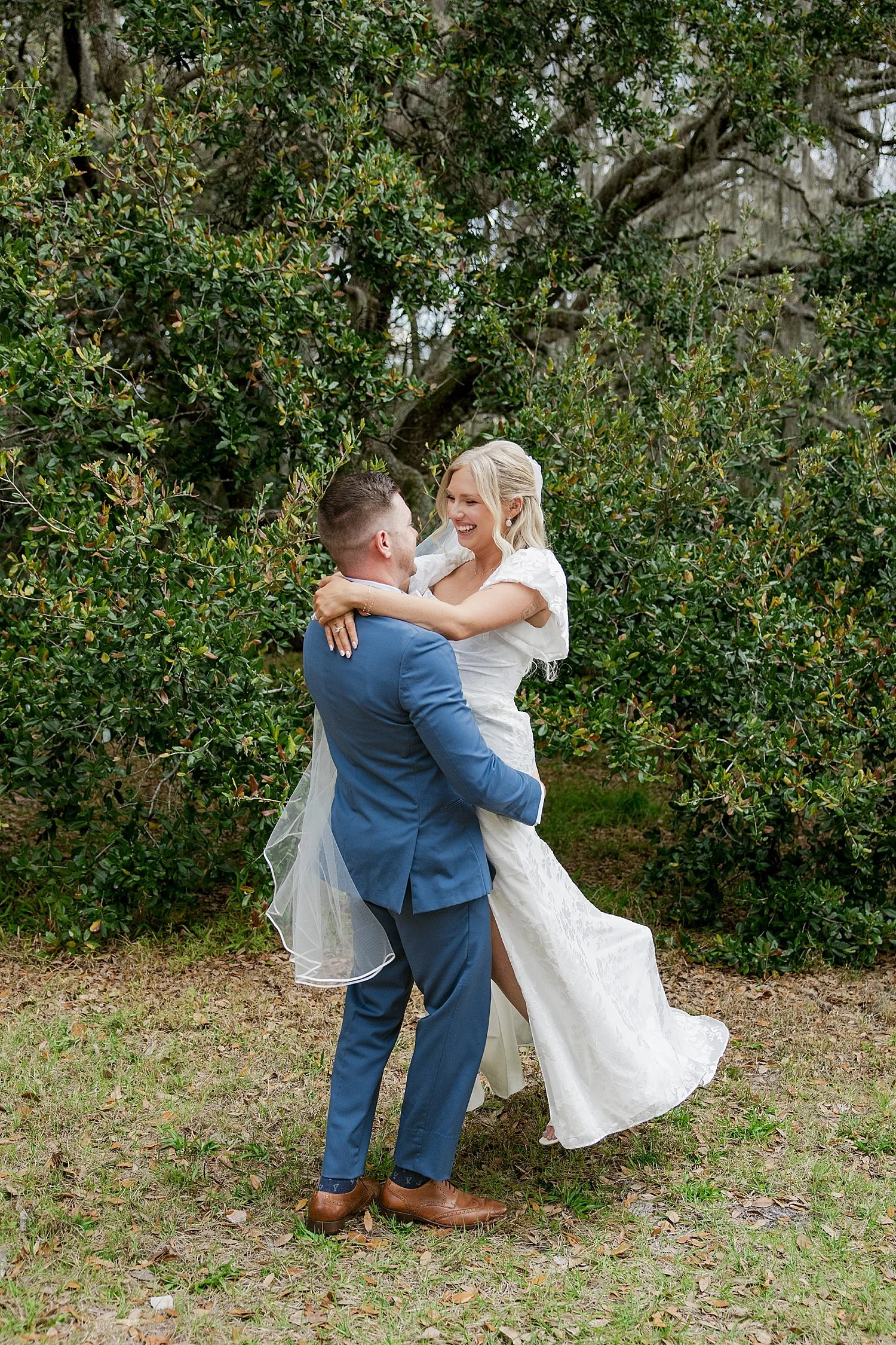  man spins his new wife in joy after ceremony by Florida wedding photographer 
