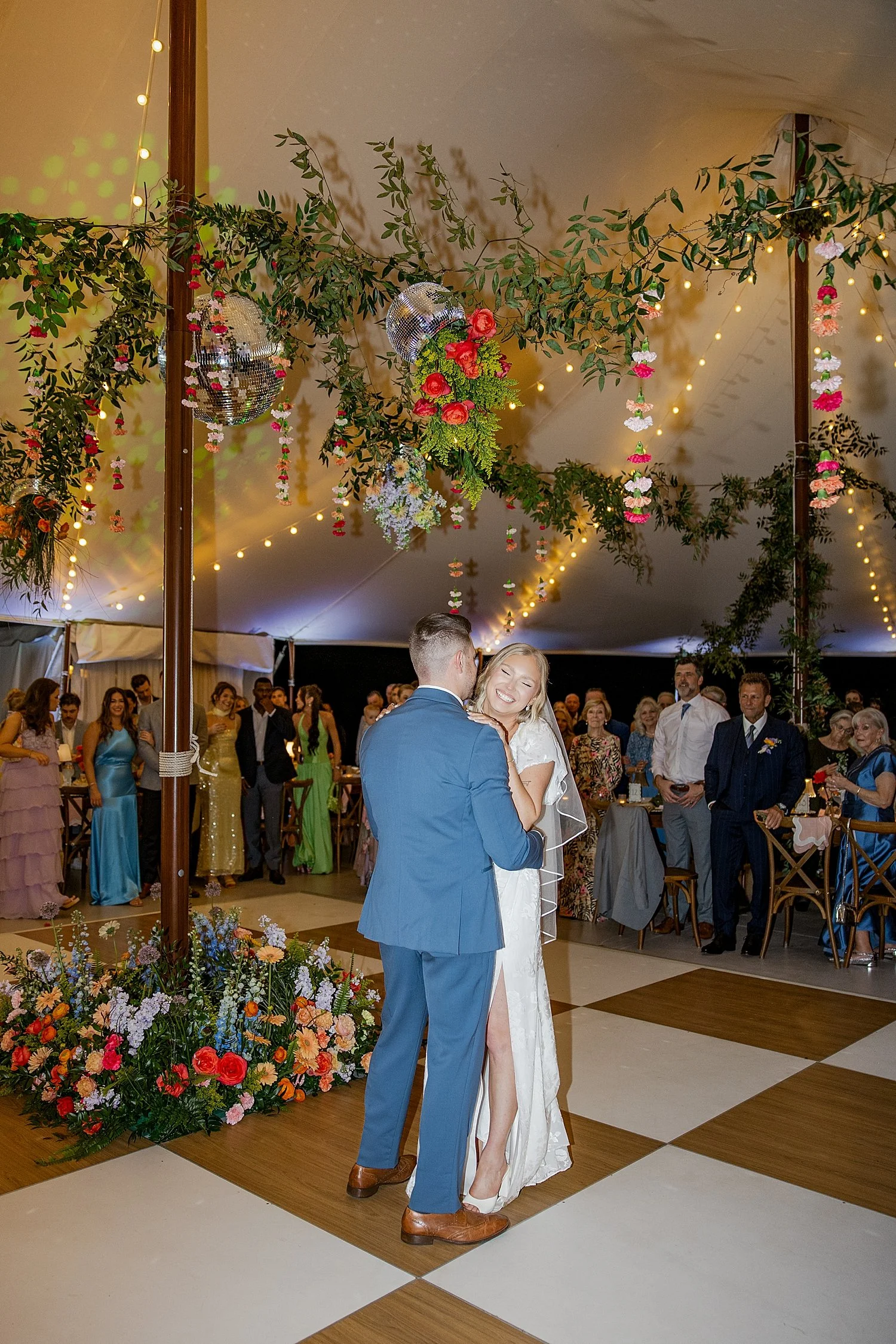 newlyweds enter the dance floor under big tent by Florida wedding photographer 