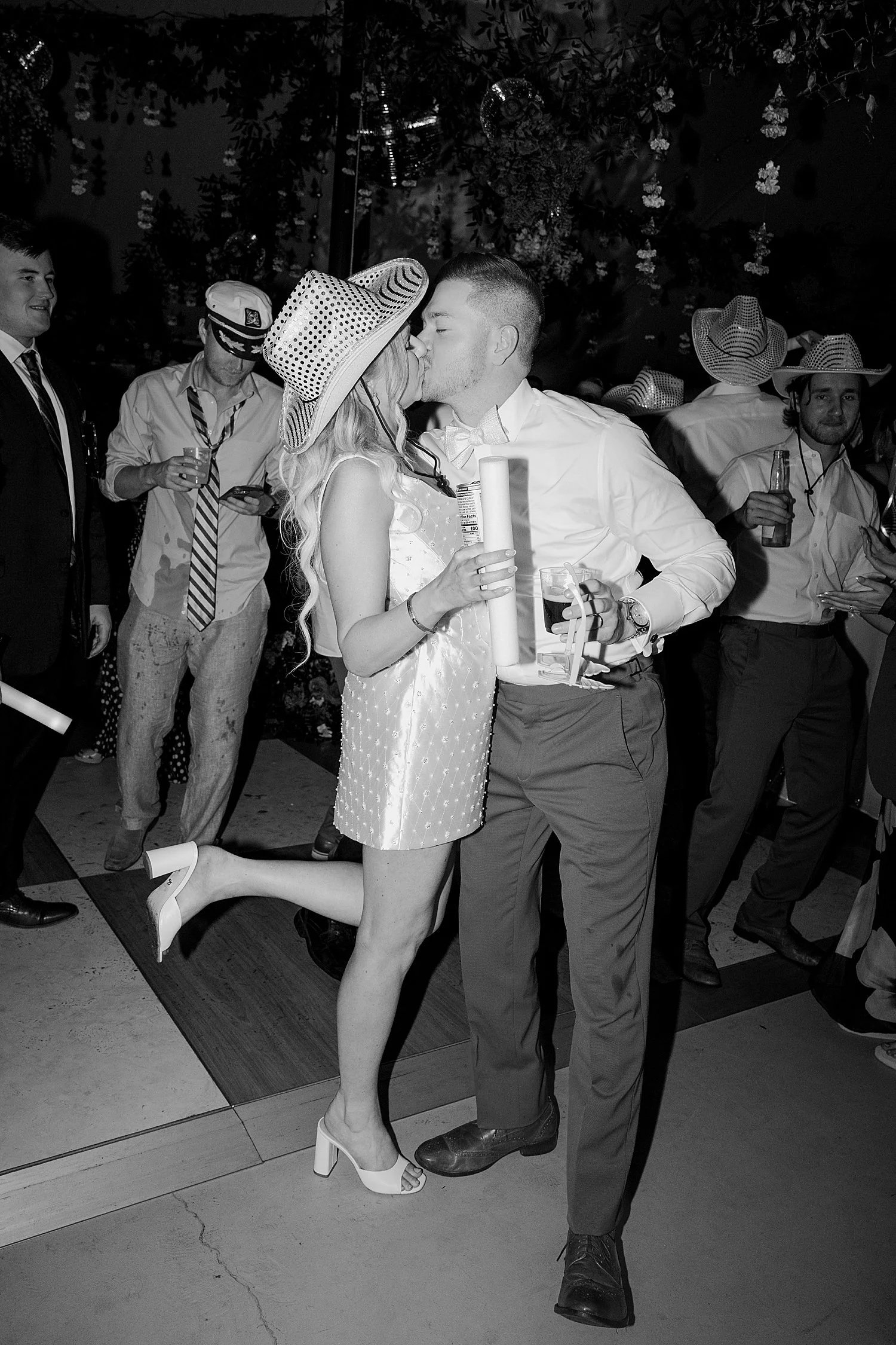  newlyweds share a kiss on dance floor by Florida wedding photographer 
