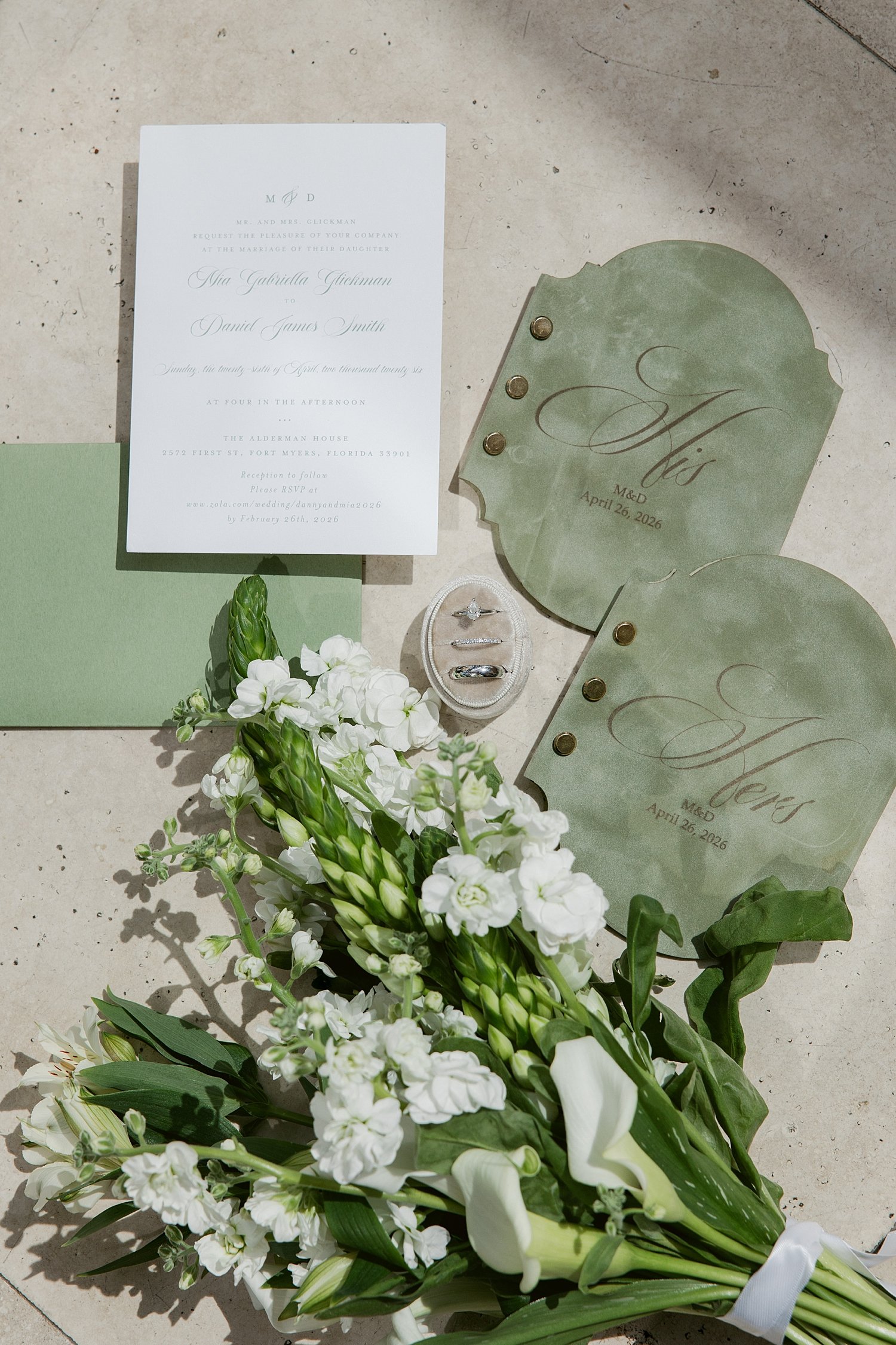  green wedding details laid out for ceremony + newlywed portraits 