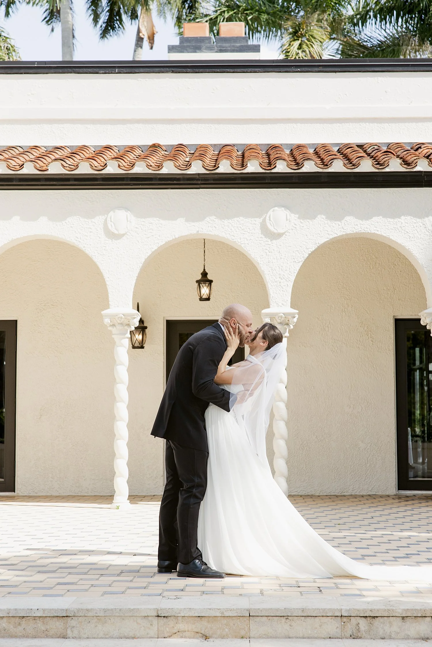  couple kisses outdoor ceremony by Florida wedding photographer 