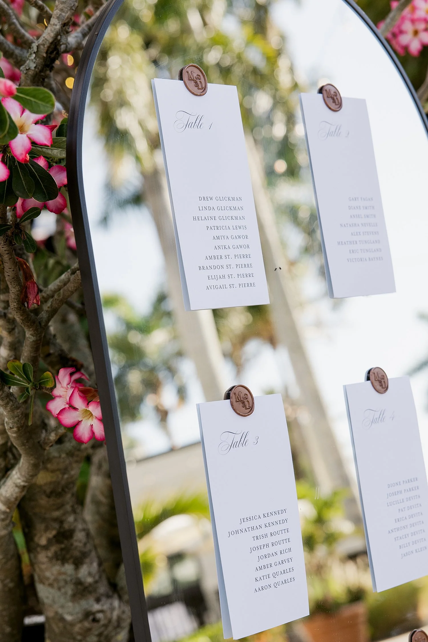  guest seating chart wax sealed onto mirror by Taylor Shea Photo 