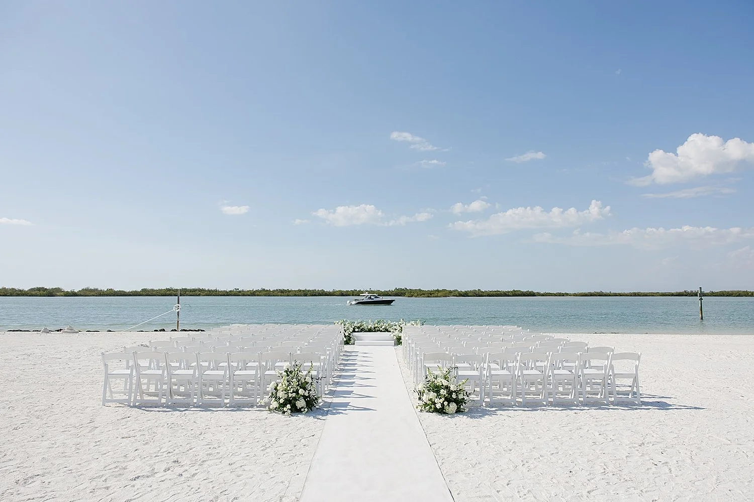  ceremony space set up on sand in front of ocean by Florida wedding photographer 