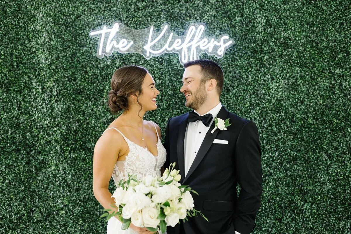 Boxwood Rose Greenery Wall Rental and Custom Neon Sign