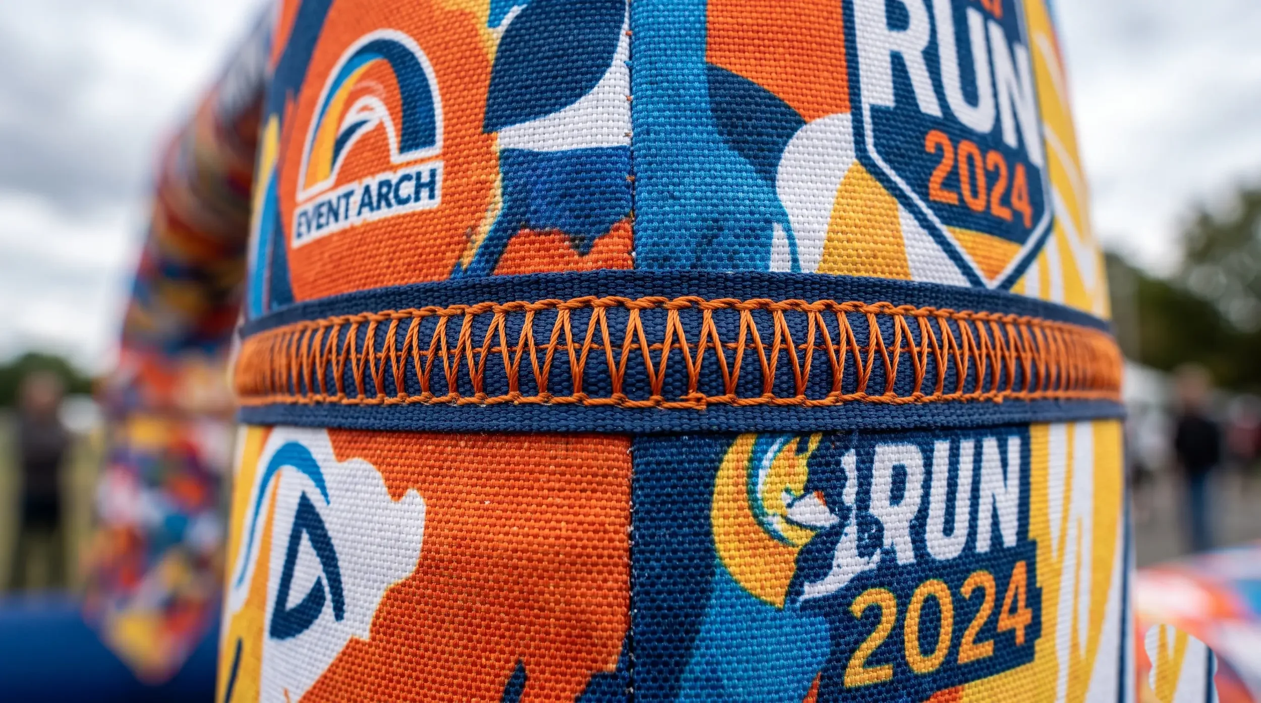 Close-up of dye-sublimated printed fabric and a reinforced seam on an inflatable arch.