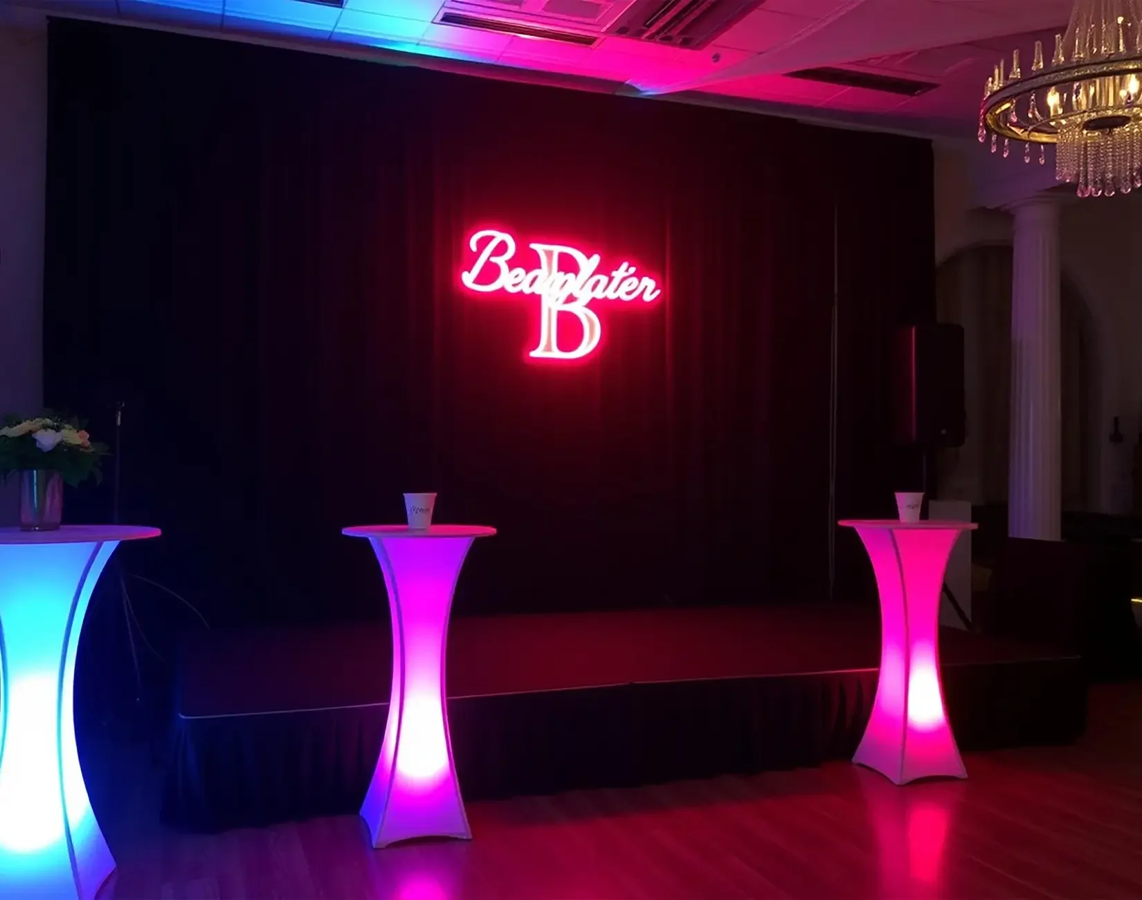 Stage with Neon Sign Backdrop - Boxwood Rose